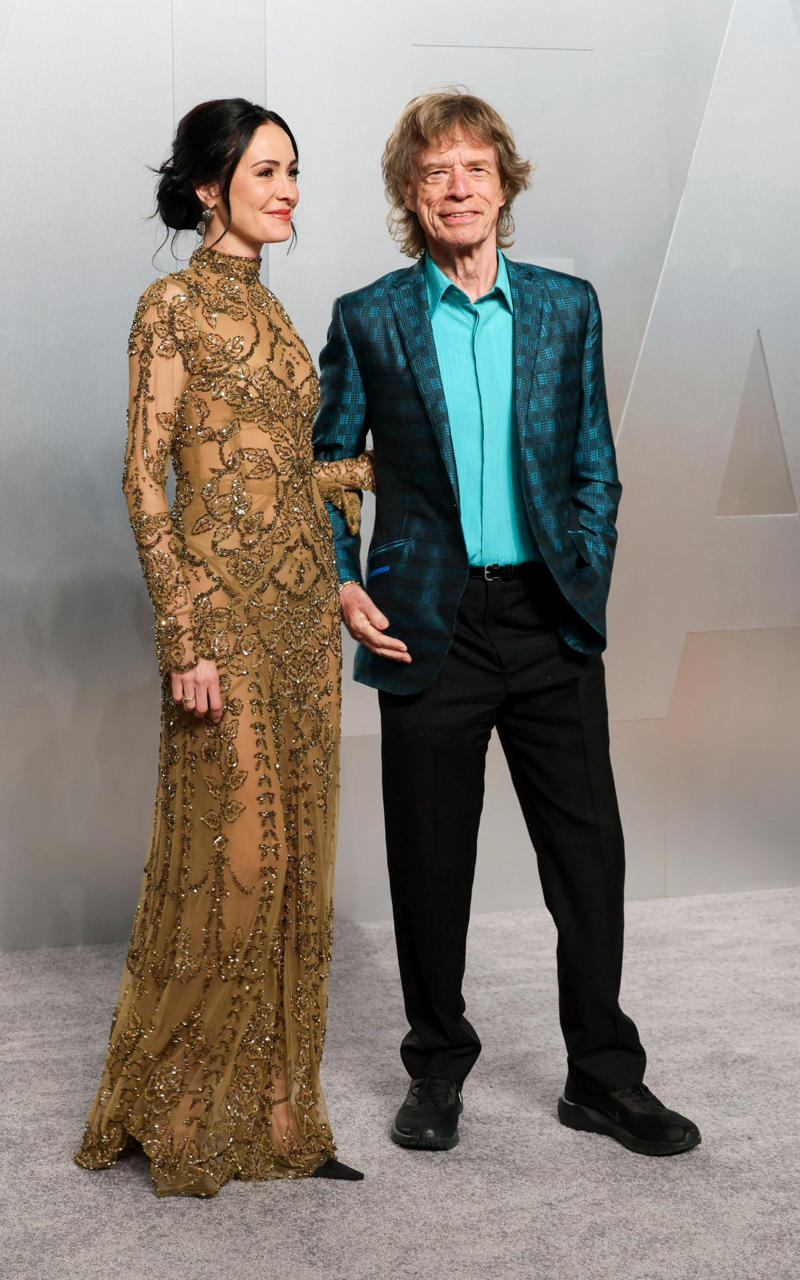 Sir Mick Jagger and Melanie Hamrick Oscars 2026, Jane Fonda, Sarah Pidgeon in Calvin Klein, Olivia Rodrigo in Saint Laurent, Naomi Watts in Balenciaga, Monica Lewinsky in Oscar de la Renta, Kim Kardashian in Gucci, Wendi Deng Murdoch and Grace Murdoch, Minnie Driver, Nicole Kidman, Marisa Abela in Revolve, Zoe Saldana in Saint Laurent, Helen Hunt in Stella McCartney, Hailey Bieber in Giorgio Armani, Kaia Gerber in Givenchy, Colman Domingo in Jacquemus, Philippine Leroy-Beaulieu, Sir Mick Jagger and Melanie Hamrick, Jeff Goldblum and Emilie Livingston in ERL Artisanal, Cara Delevingne in Thom Browne, Karlie Kloss in Gucci, Anjelica Huston, Sarah Paulson and Holland Taylor, Leslie Mann, Meg Ryan, Lauren Sanchez Bezos and Jeff Bezos, Tracee Ellis Ross in Marine Serre, Dree Hemingway in Conner Ives, Isla Fisher in Yara Shoemaker, Jessica Alba in Tamara Ralph, Kris Jenner in vintage Valentino, Rachel Sennott in Balenciaga, Dua Lipa and Callum Turner, Kristen Wiig in Monse, Elle and Dakota Fanning, Simone Ashley, Laura Harrier in Gucci, Kendall Jenner in Chanel, Grace Gummer, Mamie Gummer, Louisa Jacobson in Khaite, Suki Waterhouse and Robert Pattinson, Rita Ora in Tamara Ralph, Jessie Buckley in Chanel, Nicole Kidman in Chanel, Rose Byrne in Dior, Teyana Taylor in Chanel, Renate Reinsve in Louis Vuitton, Timothée Chalamet in Givenchy, Kylie Jenner in Schiaparelli, Demi Moore in Gucci, Gwyneth Paltrow in Armani Privé, Michael B. Jordan in Louis Vuitton, Zendaya and Robert Pattinson, Emma Stone in Louis Vuitton, Kate Hudson and Goldie Hawn, Chase Infiniti in Louis Vuitton, Felicity Jones in Prada, Anne Hathaway in Valentino, Odessa A’zion in Valentino, Wunmi Mosaku in Louis Vuitton, Elle Fanning in Givenchy, Kirsten Dunst and Jesse Plemons, Amy Madigan in Dior, Zoe Saldaña in Saint Laurent, Mia Goth in Dior, Paul Mescal and Gracie Abrams, Inga Ibsdotter Lilleaas in Loewe, Mikey Madison in Dior, Rachel McAdams in Alberta Ferretti, Mckenna Grace, Pedro Pascal in Chanel, Barbie Ferreira in GapStudio, Adrien Brody in Gucci, Jacob Elordi in Bottega Veneta, Charithra Chandran in Miss Sohee, EJAE in Dior, Audrey Nuna in Thom Browne, Rei Ami in Rahul Mishra, Huma Abedin and Anna Wintour, Leonardo DiCaprio in Dior, Kate Hawley, Damson Idris in Prada, Sigourney Weaver in Valentino, Alana Haim in Louis Vuitton, Heidi Klum, Hudson Williams in Balenciaga, Alicia Silverstone, Channing Tatum in Versace, Kathy Bates, Chloe Zhao, Joel Edgerton, Misty Copeland in David Koma, Maya Rudolph in Chanel, Ava DuVernay in Louis Vuitton, Anna Wintour, Benicio Del Toro in Giorgio Armani, Usher in Giuliva Heritage, Melissa McCarthy, Jack O’Connell in Dunhill, Lola Kirke in Simone Rocha, Fran Drescher in Ami, Jason Bateman in Dunhill, Ariana Greenblatt in John Galliano, Stellan Skarsgård, Kristen Wiig in Elie Saab, Jacobi Jupe, Kieran Culkin in Paul Smith, Nick Jonas and Priyanka Chopra Jonas, Wagner Moura in Zegna, Conan O’Brien, Vicky Krieps in Bottega Veneta, Ethan Hawke, Shaboozey in Campillo, Spike Lee, Joe Alwyn in Valentino, Kevin O’Leary, Ryan Destiny in Ami, Javier Bardem, Mark Strong in Giorgio Armani, Felix Kammerer in Saint Laurent, Ginnifer Goodwin in Monse, Susie and Nick Cave, Amelia Dimoldenberg in Ralph Lauren, Manu Rios in Saint Laurent
