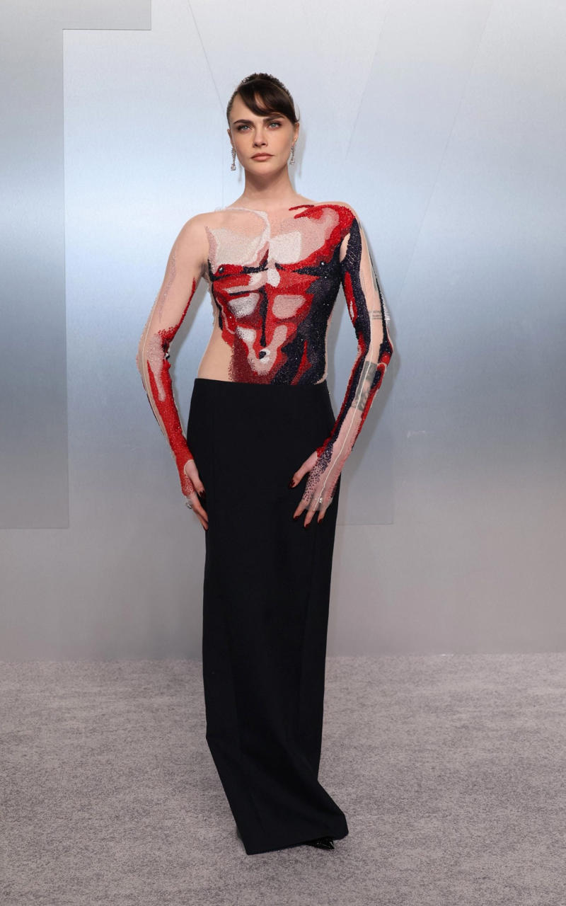 Cara Delevingne in Thom Browne Oscars 2026, Jane Fonda, Sarah Pidgeon in Calvin Klein, Olivia Rodrigo in Saint Laurent, Naomi Watts in Balenciaga, Monica Lewinsky in Oscar de la Renta, Kim Kardashian in Gucci, Wendi Deng Murdoch and Grace Murdoch, Minnie Driver, Nicole Kidman, Marisa Abela in Revolve, Zoe Saldana in Saint Laurent, Helen Hunt in Stella McCartney, Hailey Bieber in Giorgio Armani, Kaia Gerber in Givenchy, Colman Domingo in Jacquemus, Philippine Leroy-Beaulieu, Sir Mick Jagger and Melanie Hamrick, Jeff Goldblum and Emilie Livingston in ERL Artisanal, Cara Delevingne in Thom Browne, Karlie Kloss in Gucci, Anjelica Huston, Sarah Paulson and Holland Taylor, Leslie Mann, Meg Ryan, Lauren Sanchez Bezos and Jeff Bezos, Tracee Ellis Ross in Marine Serre, Dree Hemingway in Conner Ives, Isla Fisher in Yara Shoemaker, Jessica Alba in Tamara Ralph, Kris Jenner in vintage Valentino, Rachel Sennott in Balenciaga, Dua Lipa and Callum Turner, Kristen Wiig in Monse, Elle and Dakota Fanning, Simone Ashley, Laura Harrier in Gucci, Kendall Jenner in Chanel, Grace Gummer, Mamie Gummer, Louisa Jacobson in Khaite, Suki Waterhouse and Robert Pattinson, Rita Ora in Tamara Ralph, Jessie Buckley in Chanel, Nicole Kidman in Chanel, Rose Byrne in Dior, Teyana Taylor in Chanel, Renate Reinsve in Louis Vuitton, Timothée Chalamet in Givenchy, Kylie Jenner in Schiaparelli, Demi Moore in Gucci, Gwyneth Paltrow in Armani Privé, Michael B. Jordan in Louis Vuitton, Zendaya and Robert Pattinson, Emma Stone in Louis Vuitton, Kate Hudson and Goldie Hawn, Chase Infiniti in Louis Vuitton, Felicity Jones in Prada, Anne Hathaway in Valentino, Odessa A’zion in Valentino, Wunmi Mosaku in Louis Vuitton, Elle Fanning in Givenchy, Kirsten Dunst and Jesse Plemons, Amy Madigan in Dior, Zoe Saldaña in Saint Laurent, Mia Goth in Dior, Paul Mescal and Gracie Abrams, Inga Ibsdotter Lilleaas in Loewe, Mikey Madison in Dior, Rachel McAdams in Alberta Ferretti, Mckenna Grace, Pedro Pascal in Chanel, Barbie Ferreira in GapStudio, Adrien Brody in Gucci, Jacob Elordi in Bottega Veneta, Charithra Chandran in Miss Sohee, EJAE in Dior, Audrey Nuna in Thom Browne, Rei Ami in Rahul Mishra, Huma Abedin and Anna Wintour, Leonardo DiCaprio in Dior, Kate Hawley, Damson Idris in Prada, Sigourney Weaver in Valentino, Alana Haim in Louis Vuitton, Heidi Klum, Hudson Williams in Balenciaga, Alicia Silverstone, Channing Tatum in Versace, Kathy Bates, Chloe Zhao, Joel Edgerton, Misty Copeland in David Koma, Maya Rudolph in Chanel, Ava DuVernay in Louis Vuitton, Anna Wintour, Benicio Del Toro in Giorgio Armani, Usher in Giuliva Heritage, Melissa McCarthy, Jack O’Connell in Dunhill, Lola Kirke in Simone Rocha, Fran Drescher in Ami, Jason Bateman in Dunhill, Ariana Greenblatt in John Galliano, Stellan Skarsgård, Kristen Wiig in Elie Saab, Jacobi Jupe, Kieran Culkin in Paul Smith, Nick Jonas and Priyanka Chopra Jonas, Wagner Moura in Zegna, Conan O’Brien, Vicky Krieps in Bottega Veneta, Ethan Hawke, Shaboozey in Campillo, Spike Lee, Joe Alwyn in Valentino, Kevin O’Leary, Ryan Destiny in Ami, Javier Bardem, Mark Strong in Giorgio Armani, Felix Kammerer in Saint Laurent, Ginnifer Goodwin in Monse, Susie and Nick Cave, Amelia Dimoldenberg in Ralph Lauren, Manu Rios in Saint Laurent