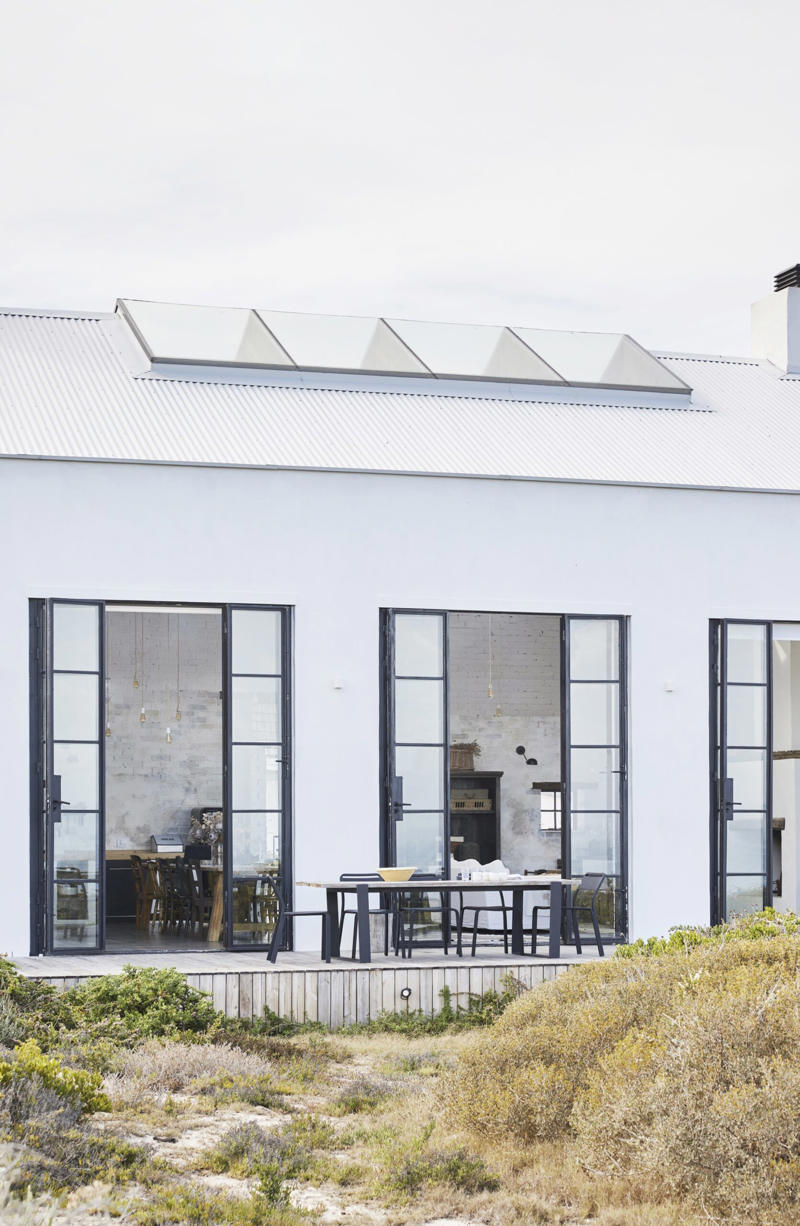 What are some of the key design elements of barn houses?, 23 modern barn-style houses with design ideas to inspire, A barn house with waterfront views , The Little Red Barn , Port Farm , A shed conversion in the Scenic Rim , Black & Bright alpine stay , An 1880s red farmhouse , An eco-friendly family home , The Barn at Rangeview , The classic barn-style house , The Highlands Black Barn , A barn-style new build , Two barns on a biodynamic farm , A barn conversion , The Sir George , Monochromatic barn house , A barn-style home in the Wolgan Valley , A European-inspired brick barn , Modern barn home , Barn-style beach house , A cosy country farmhouse , A country retreat with alpine style , An interior designer’s highlands weekender , A Queensland pool house , What is the difference between a barndo and a barn-style house?, What is the difference between a barn house and a farmhouse?, Are barn-style houses cheap to build?