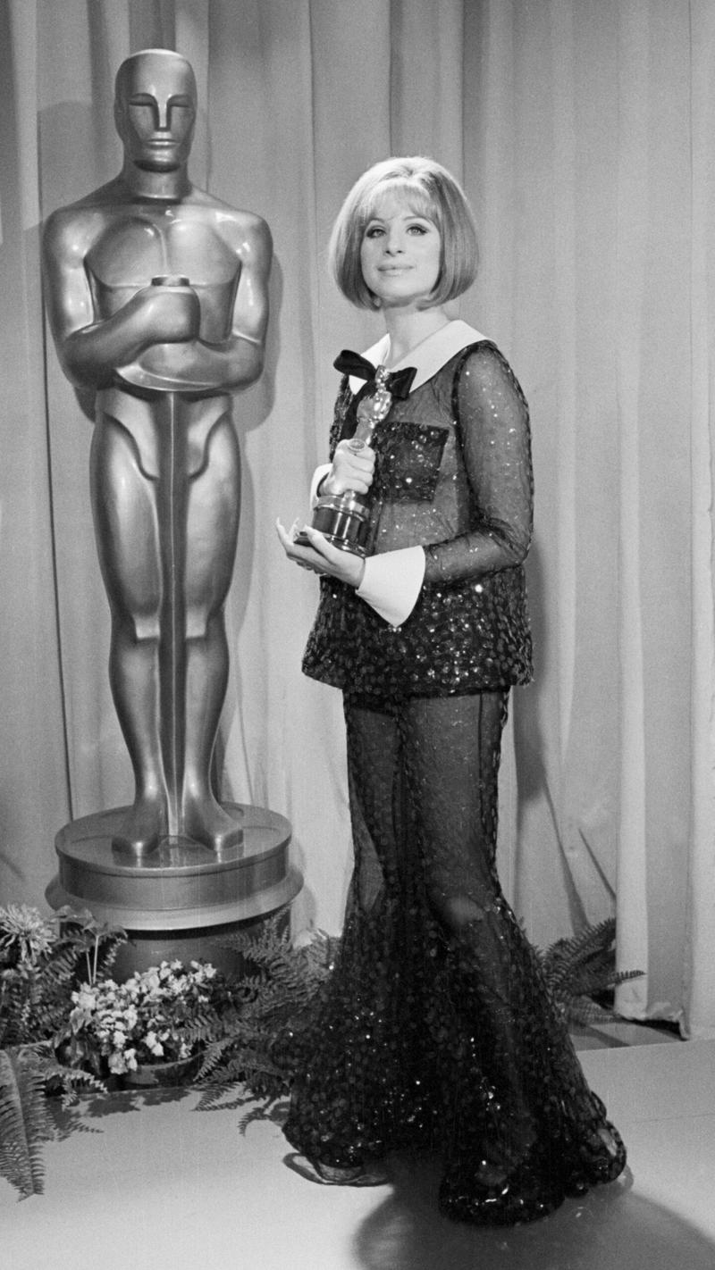 Ariana Grande in Schiaparelli Couture and De Beers Jewellery , Zoe Saldaña in Custom Saint Laurent and Cartier High Jewellery , Margaret Qualley in Chanel , Selena Gomez in Ralph Lauren and Bvlgari High Jewellery , Elle Fanning in Sarah Burton For Givenchy and Cartier Jewellery , Quannah Chasinghorse in Red Berry Woman , Jennifer Lawrence in Dior , Danai Gurira in Jason Wu and Messika , Jessie Buckley in Rodarte , Zendaya in Custom Valentino , Janelle Monáe in Ralph Lauren , Gemma Chan in Valentino , Saoirse Ronan in Calvin Klein , Margot Robbie in Chanel , Ruth Negga in Valentino , Zendaya, Vivienne Westwood , Cate Blanchett in Armani Privé , Lupita Nyong’o in Prada , Jennifer Lawrence in Christian Dior , Anne Hathaway in Valentino , Diane Kruger in Chanel , Sarah Jessica Parker in Chanel , Marion Cotillard in Jean Paul Gaultier , Penélope Cruz in Atelier Versace , Gwyneth Paltrow in Zac Posen , Michelle Williams in Vera Wang , Hilary Swank in Guy Laroche , Charlize Theron in Gucci , Angelina Jolie in Marc Bouwer , Jennifer Lopez in Valentino , Halle Berry in Elie Saab , Björk in Marjan Pejoski , Renée Zellweger in vintage Jean Dessès , Gwyneth Paltrow in Ralph Lauren , Sharon Stone in Gap and Vera Wang , Cher in Bob Mackie , Courtney Love in Versace , Nicole Kidman in John Galliano for Christian Dior , Winona Ryder in Chanel , Kate Winslet in Vivienne Westwood , Claudia Schiffer in Versace , Winona Ryder in Badgley Mischka , Cindy Crawford in Hervé Léger , Juliette Lewis in vintage gown , Martha Plimpton in vintage gown , Jamie Lee Curtis in Marlene Dietrich vintage , Farrah Fawcett in Stephen Burrow , Cher in Bob Mackie , Elizabeth Taylor in Edith Head , Barbra Streisand in Arnold Scaasi , Grace Kelly in Edith Head