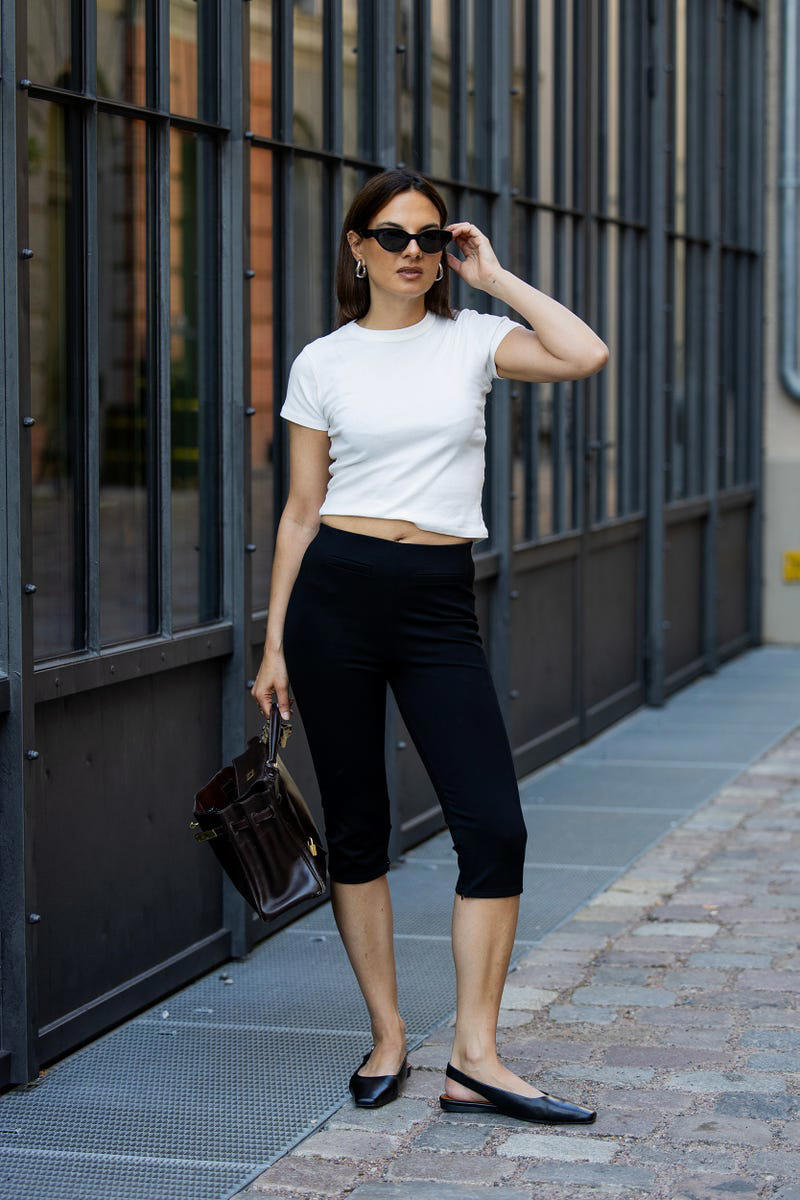 Shop the Best White T-Shirts, A Baby Tee and Straight-Leg Denim, A Relaxed T-Shirt and Brown Jacket, A Boxy Style and Classic Trench, A Monochrome Combination, Black Capris and Ballet Flats, A Statement Skirt and Wool Sweater, A Matching Suit Set, A Tailored Jacket and Pleated Skirt, White Linen Shorts and Leather Boots