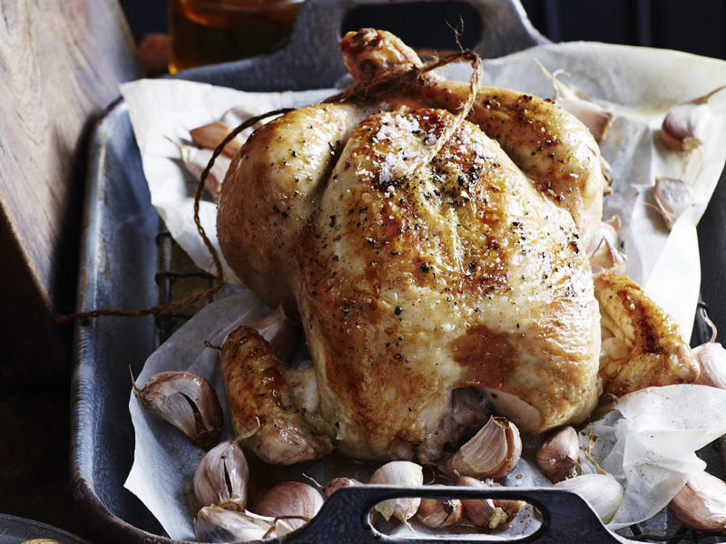 How to tell if your roast chicken is cooked,          Garlic butter roast chicken with heirloom tomatoes      ,          Best-ever air fryer roast chicken      ,          Roast chicken with cheesy green polenta      ,          Butterflied soy and ginger chicken      ,          Classic roast chicken with gravy      ,          Air fryer roast chicken with secret herbs and spices      ,          Chicken and artichoke pot roast      ,          French-style roast chicken      ,          Butterflied roast chicken with leek      ,          Roasted sumac chicken with baby vegetables      ,          Classic roast chicken      ,          Chicken in a pot      ,          Asian-style roast chicken      ,          Spanish-style roast chicken      ,          Cajun roast chicken with corn cream      ,          Moroccan roast chicken and cauliflower      ,          Tea brined roasted chicken      ,          Roast chicken with lemon and garlic      ,          Mustard roast chicken      ,          Paprika roast chicken with corn and polenta stuffing      ,          Roast chicken for two      ,          Roasted lemon thyme chicken      ,          Roast chicken with 40 cloves of garlic      ,          Tarragon roast chicken with crispy potatoes      ,          Garlic and oregano roast chicken      ,          Roast chicken with garlic potatoes and rosemary      ,          Lemon thyme and chilli roast chicken      ,          Roast chicken with broad beans and lemon      , Sides for your roast chicken dinner
