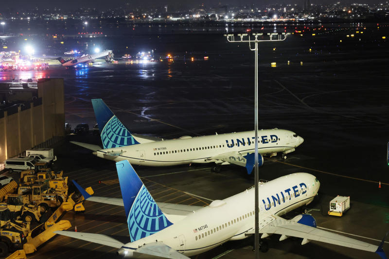 An Air Canada Express plane sits on the tarmac after it collided with a fire truck at LaGuardia Airport on March 23, 2026 in New York City.
