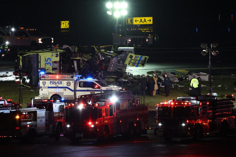 Emergency personnel respond to the Port Authority fire truck that was struck by a landing Air Canada Express plane at LaGuardia Airport in New York, on March 23, 2026.