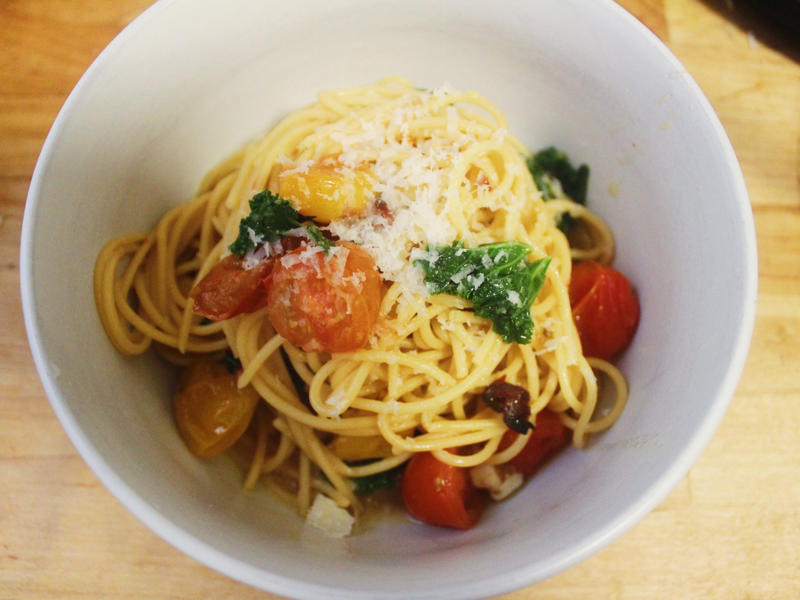 I was really impressed by the final result and by how easy it was to make. I started by gathering the ingredients for the one-pot pasta., I chopped the tomatoes in half and added them to my skillet., I then added about a box of spaghetti to the pan., While the pasta was cooking, I chopped the Swiss chard.