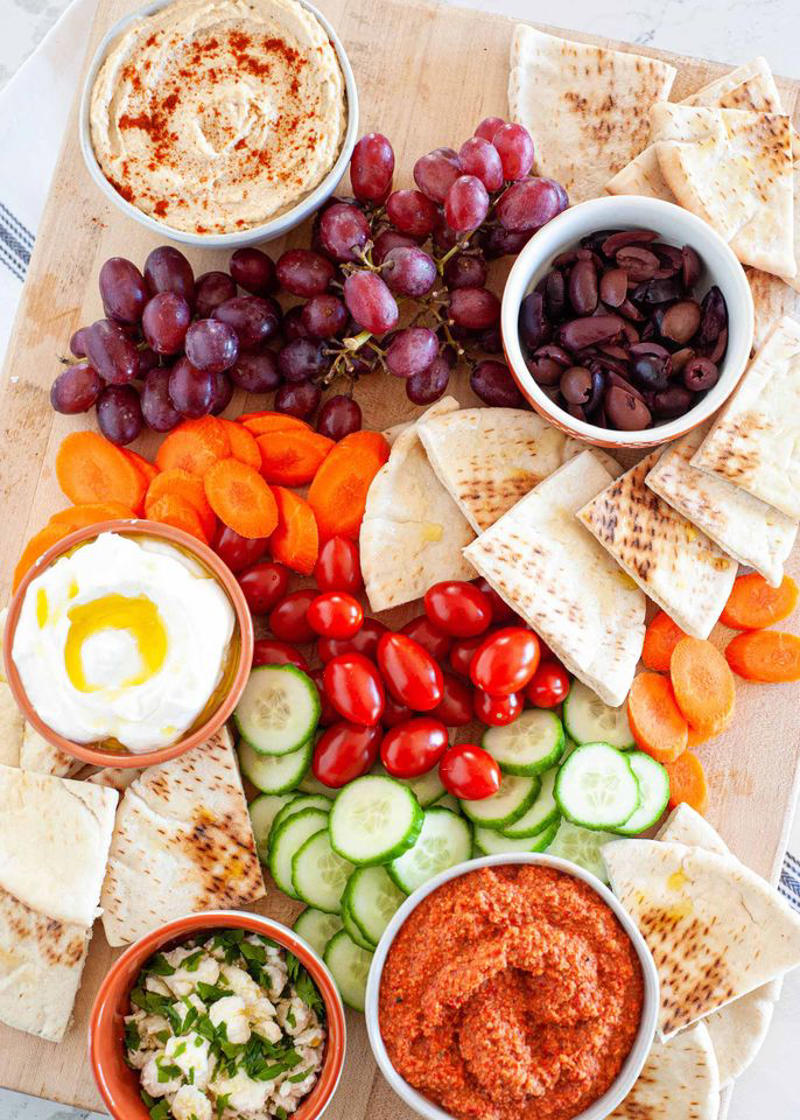 Pea Pesto, Hot Ham and Cheese Sliders, Whipped Feta with Figs, Pistachio, and Honey, Prosciutto and Cheese Puff Pastry Pinwheels, Classic Cheese Ball, Shrimp Cocktail, Creamy Zucchini Dip, Deviled Eggs with Horseradish and Dill, Mini Salmon Quiches, Honey Chorizo Dip, Slow Cooker Glazed Cocktail Meatballs, Easy Baked Brie in Puff Pastry, Smoked Salmon Crostini, Mediterranean Mezze Platter, Classic Stuffed Mushrooms, Million Dollar Deviled Eggs