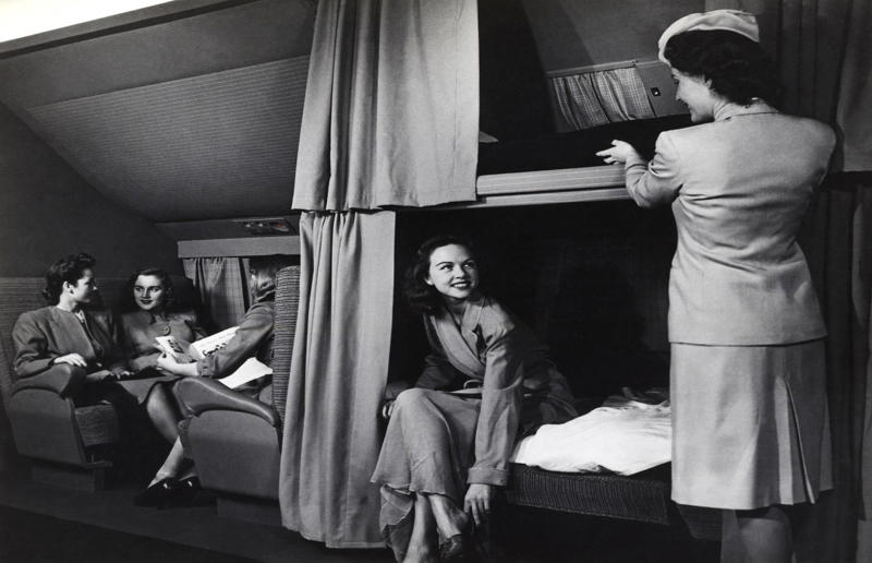 1940s: interior of a McDonnell Douglas DC-6 A flight back in time, 1920s: the beginnings of air travel, 1920s: a passenger compartment from the 1920s, 1920s: inside a Transcontinental Air Transport plane, 1920s: bed compartments of a German Junker aircraft, 1920s: a flight attendant serves drinks on a French Airliner service, 1920s: an early German Deutsche Luft Hansa plane, 1920s: the Dornier Do X dining salon, 1920s: the first ever in-flight movie, 1920s: enjoying breakfast at 3,000 feet (914m), 1920s: passengers get weighed before their flight, 1930s: passengers climb aboard a plane at Croydon Airport, England, 1930s: crew members check bags before a flight to LA, 1930s: the check-in desk at newly opened Gatwick Airport, 1930s: an early plane with wicker seats, 1930s: the comfortable seats of a Handley Page HP42, 1930s: a plush Imperial Airways cabin, 1930s: passengers aboard the Douglas DC-1, 1930s: a flight attendant serves tea in bed, 1930s: ladies travelling on an Eastern Air Transport plane, 1930s: chefs load up a plane with homemade treats, 1930s: women in their finest attire wait to board a plane, 1930s: passengers listen to a broadcast aboard a flight, Early 1940s: passengers on board the Junkers G.38 plane, 1940s: day cabins inside an Imperial Airways flying boat, 1940s: interior of a McDonnell Douglas DC-6, 1940s: inside a Sikorsky S-40 flying boat, Late 1930s: the early days of Pan Am, 1940s: Pan American Airlines' Boeing 314 Clipper sets off, 1940s: inside the Boeing 314 flying boat, 1940s: it wasn't cheap to fly aboard the Boeing 314, 1940s: a couple enjoys dinner aboard the Boeing 314, 1940s: the early days of Heathrow Airport, 1940s: Boeing 307 Stratoliner's cocktail lounge, 1940s: the overnight intercontinental service onboard Boeing Stratocruiser, 1940s: the communal lounge aboard a Boeing aeroplane, 1950s: guests relax in an onboard lounge compartment, 1950s: the Sky-Cot aboard a British Overseas Airways Corporation flight, 1950s: a movie projector on a United Airlines flight