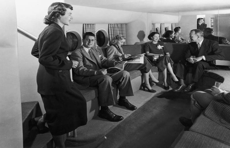 1940s: the communal lounge aboard a Boeing aeroplane A flight back in time, 1920s: the beginnings of air travel, 1920s: a passenger compartment from the 1920s, 1920s: inside a Transcontinental Air Transport plane, 1920s: bed compartments of a German Junker aircraft, 1920s: a flight attendant serves drinks on a French Airliner service, 1920s: an early German Deutsche Luft Hansa plane, 1920s: the Dornier Do X dining salon, 1920s: the first ever in-flight movie, 1920s: enjoying breakfast at 3,000 feet (914m), 1920s: passengers get weighed before their flight, 1930s: passengers climb aboard a plane at Croydon Airport, England, 1930s: crew members check bags before a flight to LA, 1930s: the check-in desk at newly opened Gatwick Airport, 1930s: an early plane with wicker seats, 1930s: the comfortable seats of a Handley Page HP42, 1930s: a plush Imperial Airways cabin, 1930s: passengers aboard the Douglas DC-1, 1930s: a flight attendant serves tea in bed, 1930s: ladies travelling on an Eastern Air Transport plane, 1930s: chefs load up a plane with homemade treats, 1930s: women in their finest attire wait to board a plane, 1930s: passengers listen to a broadcast aboard a flight, Early 1940s: passengers on board the Junkers G.38 plane, 1940s: day cabins inside an Imperial Airways flying boat, 1940s: interior of a McDonnell Douglas DC-6, 1940s: inside a Sikorsky S-40 flying boat, Late 1930s: the early days of Pan Am, 1940s: Pan American Airlines' Boeing 314 Clipper sets off, 1940s: inside the Boeing 314 flying boat, 1940s: it wasn't cheap to fly aboard the Boeing 314, 1940s: a couple enjoys dinner aboard the Boeing 314, 1940s: the early days of Heathrow Airport, 1940s: Boeing 307 Stratoliner's cocktail lounge, 1940s: the overnight intercontinental service onboard Boeing Stratocruiser, 1940s: the communal lounge aboard a Boeing aeroplane, 1950s: guests relax in an onboard lounge compartment, 1950s: the Sky-Cot aboard a British Overseas Airways Corporation flight, 1950s: a movie projector on a United Airlines flight
