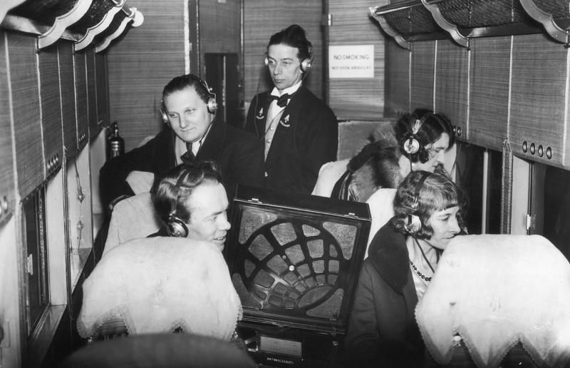1930s: passengers listen to a broadcast aboard a flight A flight back in time, 1920s: the beginnings of air travel, 1920s: a passenger compartment from the 1920s, 1920s: inside a Transcontinental Air Transport plane, 1920s: bed compartments of a German Junker aircraft, 1920s: a flight attendant serves drinks on a French Airliner service, 1920s: an early German Deutsche Luft Hansa plane, 1920s: the Dornier Do X dining salon, 1920s: the first ever in-flight movie, 1920s: enjoying breakfast at 3,000 feet (914m), 1920s: passengers get weighed before their flight, 1930s: passengers climb aboard a plane at Croydon Airport, England, 1930s: crew members check bags before a flight to LA, 1930s: the check-in desk at newly opened Gatwick Airport, 1930s: an early plane with wicker seats, 1930s: the comfortable seats of a Handley Page HP42, 1930s: a plush Imperial Airways cabin, 1930s: passengers aboard the Douglas DC-1, 1930s: a flight attendant serves tea in bed, 1930s: ladies travelling on an Eastern Air Transport plane, 1930s: chefs load up a plane with homemade treats, 1930s: women in their finest attire wait to board a plane, 1930s: passengers listen to a broadcast aboard a flight, Early 1940s: passengers on board the Junkers G.38 plane, 1940s: day cabins inside an Imperial Airways flying boat, 1940s: interior of a McDonnell Douglas DC-6, 1940s: inside a Sikorsky S-40 flying boat, Late 1930s: the early days of Pan Am, 1940s: Pan American Airlines' Boeing 314 Clipper sets off, 1940s: inside the Boeing 314 flying boat, 1940s: it wasn't cheap to fly aboard the Boeing 314, 1940s: a couple enjoys dinner aboard the Boeing 314, 1940s: the early days of Heathrow Airport, 1940s: Boeing 307 Stratoliner's cocktail lounge, 1940s: the overnight intercontinental service onboard Boeing Stratocruiser, 1940s: the communal lounge aboard a Boeing aeroplane, 1950s: guests relax in an onboard lounge compartment, 1950s: the Sky-Cot aboard a British Overseas Airways Corporation flight, 1950s: a movie projector on a United Airlines flight
