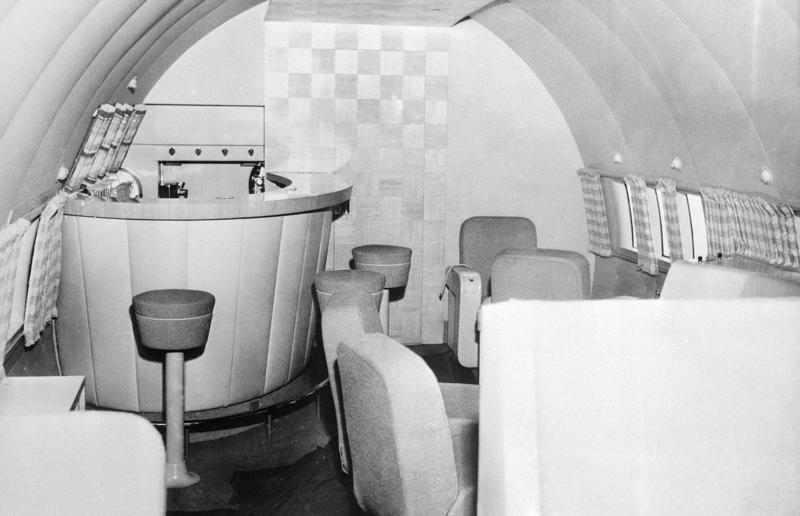 1940s: Boeing 307 Stratoliner's cocktail lounge A flight back in time, 1920s: the beginnings of air travel, 1920s: a passenger compartment from the 1920s, 1920s: inside a Transcontinental Air Transport plane, 1920s: bed compartments of a German Junker aircraft, 1920s: a flight attendant serves drinks on a French Airliner service, 1920s: an early German Deutsche Luft Hansa plane, 1920s: the Dornier Do X dining salon, 1920s: the first ever in-flight movie, 1920s: enjoying breakfast at 3,000 feet (914m), 1920s: passengers get weighed before their flight, 1930s: passengers climb aboard a plane at Croydon Airport, England, 1930s: crew members check bags before a flight to LA, 1930s: the check-in desk at newly opened Gatwick Airport, 1930s: an early plane with wicker seats, 1930s: the comfortable seats of a Handley Page HP42, 1930s: a plush Imperial Airways cabin, 1930s: passengers aboard the Douglas DC-1, 1930s: a flight attendant serves tea in bed, 1930s: ladies travelling on an Eastern Air Transport plane, 1930s: chefs load up a plane with homemade treats, 1930s: women in their finest attire wait to board a plane, 1930s: passengers listen to a broadcast aboard a flight, Early 1940s: passengers on board the Junkers G.38 plane, 1940s: day cabins inside an Imperial Airways flying boat, 1940s: interior of a McDonnell Douglas DC-6, 1940s: inside a Sikorsky S-40 flying boat, Late 1930s: the early days of Pan Am, 1940s: Pan American Airlines' Boeing 314 Clipper sets off, 1940s: inside the Boeing 314 flying boat, 1940s: it wasn't cheap to fly aboard the Boeing 314, 1940s: a couple enjoys dinner aboard the Boeing 314, 1940s: the early days of Heathrow Airport, 1940s: Boeing 307 Stratoliner's cocktail lounge, 1940s: the overnight intercontinental service onboard Boeing Stratocruiser, 1940s: the communal lounge aboard a Boeing aeroplane, 1950s: guests relax in an onboard lounge compartment, 1950s: the Sky-Cot aboard a British Overseas Airways Corporation flight, 1950s: a movie projector on a United Airlines flight