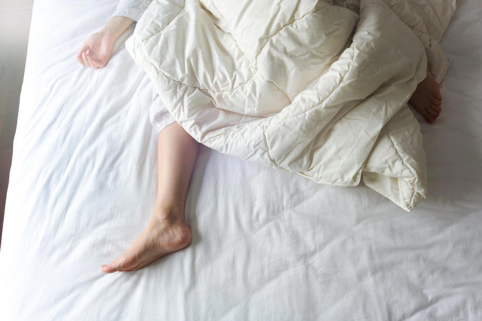1. Freeze your sheets and pillowcases, 2. Also throw your socks in the freezer, 3. Use house fans to make your own AC, 4. Use a wet towel layer, 6. Use cooling bed linens, 7. Consider a cooling mattress, 8. Block out the daytime sun and heat, 9. Sleep on the first level of your home, 10. Drink ice water before bed