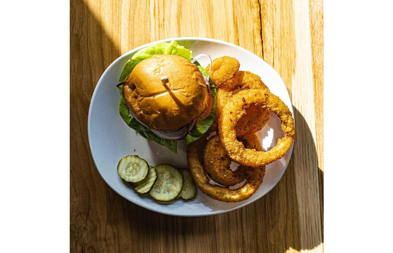 Idaho: The Classic, Holy Cow, Eagle and Nampa 54. Tennessee: Dyer's Single, Dyer's Burgers, Memphis, 53. Alabama: hamburger, Dub's Burgers, Athens, 52. Connecticut: The Original Burger, Louis' Lunch, New Haven, 51. California: Steakburger, The Apple Pan, Los Angeles, 50. Iowa: hamburger, B-Bops, various locations, 49. Maine: hamburger, Black Cow, Portland, 48. New Jersey: hamburger, White Manna, Hackensack, 47. New Hampshire: hamburger, Gilley’s Diner, Portsmouth, 46. Massachusetts: Hamburg, White Hut, West Springfield, 45. California: hamburger, In-N-Out Burger, various locations, 44. District of Columbia: Farmhouse Burger, Good Stuff Eatery, Georgetown, 43. Mississippi: Slugburger, Latham's Hamburger Inn, New Albany, 42. Utah: Big Ben, Burger Bar, Roy, 41. Wisconsin: hamburger, Sobelman's Pub & Grill, Milwaukee, 40. Wyoming: The Liberty Burger, Liberty Burger, Jackson, 39. Illinois: House-blend prime beef burger, Butcher & The Burger, Chicago, 38. Arizona: The Standard at The Stand Arcadia Burger Shoppe, Phoenix, 37. Colorado: Cricket Burger, The Cherry Cricket, Denver, 36. New York: Luger burger, Peter Luger Steakhouse, New York City, 35. Delaware: FTC, Farmer & the Cow, Wilmington, 34. Minnesota: Jucy Lucy, Matt’s Bar, Minneapolis, 33. Pennsylvania: hamburger, M2O Burgers & Salads, Philadelphia, 32. South Carolina: Classic, Big Gun Burger Shop, Charleston, 31. Idaho: The Classic, Holy Cow!, Nampa, 30. Kansas: House Burger, Dempsey's Burger Pub, Wichita, 29. Missouri: hamburger, Town Topic, Kansas City, 28. Nebraska: The Original, Cheeseburgers, Omaha, 27. New Mexico: Rustic, Rustic On The Green, Albuquerque, 26. Indiana: Smash burger, Workingman’s Friend, Indianapolis, 25. Vermont: Worthy Burger, Worthy Burger, South Royalton and Woodstock, 24. Arkansas: traditional hamburger, Hugo's, Fayetteville, 23. Texas: Tookie's Burger, Tookie's Hamburgers & More, Kemah, 22. Nevada: Plain Jane, Beefy's, Reno, 21. Georgia: Green Truck Classic, Green Truck Pub, Savannah, 20. New York: hamburger, All-American Hamburger Drive-In, Massapequa, 19. North Dakota: Carport, Sickies Garage Burgers & Brews, various locations, 18. Michigan: sliders, Motz’s Burgers, Detroit, 17. Michigan: Ground Round, Miller’s Bar, Dearborn, 16. Florida: hamburger, Mac's Drive-Thru, Gainesville, 15. West Virginia: Oscar, Oscar’s Breakfast, Burgers & Brews, Barboursville, 14. North Carolina: hamburger, Brooks’ Sandwich House, Charlotte, 13. Kentucky: The Purist, Bard's Burgers & Chili, Covington, 12. Maryland: Hamburger, Burger Bros., Towson, 11. Oklahoma: single onion burger, Tucker's Onion Burgers, various locations, 10. Rhode Island: Stanley Burger, Stanley’s Famous Hamburgers, Central Falls, 9. Virginia: Beauvine, Beauvine Burger Concept, Richmond, 8. Oregon: The Original 100, Hwy 101 Burger, Lincoln City, 7. Ohio: hamburger, Kewpee Hamburgers, Lima, 6. Hawaii: hamburger, Kua Aina Sandwich Shop, Haleiwa, 5. Alaska: The Burger Stop, Tommy's Burger Stop, Anchorage, 4. Montana: Hamburger, The Burger Drive, Billings, 3. Washington: Seattle Classic, Von's 1000 Spirits, Seattle, 2. Louisiana: Butcher Burger, Cochon Butcher, New Orleans