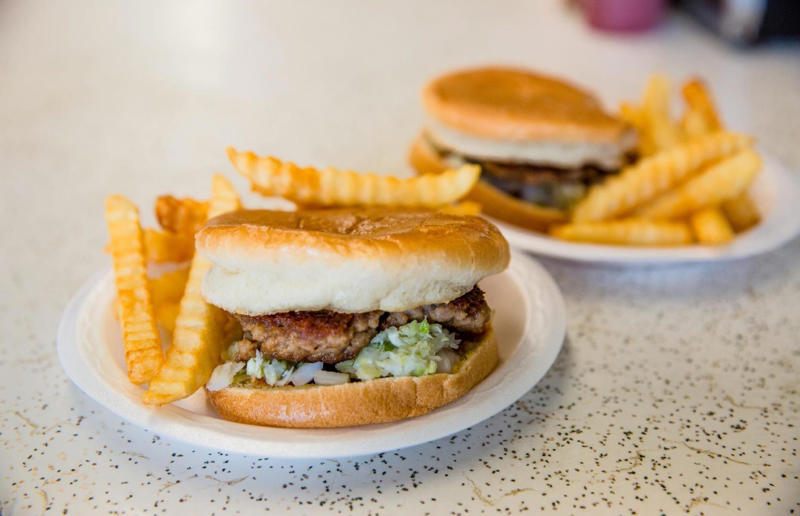 Alabama: hamburger, Dub's Burgers, Athens 54. Tennessee: Dyer's Single, Dyer's Burgers, Memphis, 53. Alabama: hamburger, Dub's Burgers, Athens, 52. Connecticut: The Original Burger, Louis' Lunch, New Haven, 51. California: Steakburger, The Apple Pan, Los Angeles, 50. Iowa: hamburger, B-Bops, various locations, 49. Maine: hamburger, Black Cow, Portland, 48. New Jersey: hamburger, White Manna, Hackensack, 47. New Hampshire: hamburger, Gilley’s Diner, Portsmouth, 46. Massachusetts: Hamburg, White Hut, West Springfield, 45. California: hamburger, In-N-Out Burger, various locations, 44. District of Columbia: Farmhouse Burger, Good Stuff Eatery, Georgetown, 43. Mississippi: Slugburger, Latham's Hamburger Inn, New Albany, 42. Utah: Big Ben, Burger Bar, Roy, 41. Wisconsin: hamburger, Sobelman's Pub & Grill, Milwaukee, 40. Wyoming: The Liberty Burger, Liberty Burger, Jackson, 39. Illinois: House-blend prime beef burger, Butcher & The Burger, Chicago, 38. Arizona: The Standard at The Stand Arcadia Burger Shoppe, Phoenix, 37. Colorado: Cricket Burger, The Cherry Cricket, Denver, 36. New York: Luger burger, Peter Luger Steakhouse, New York City, 35. Delaware: FTC, Farmer & the Cow, Wilmington, 34. Minnesota: Jucy Lucy, Matt’s Bar, Minneapolis, 33. Pennsylvania: hamburger, M2O Burgers & Salads, Philadelphia, 32. South Carolina: Classic, Big Gun Burger Shop, Charleston, 31. Idaho: The Classic, Holy Cow!, Nampa, 30. Kansas: House Burger, Dempsey's Burger Pub, Wichita, 29. Missouri: hamburger, Town Topic, Kansas City, 28. Nebraska: The Original, Cheeseburgers, Omaha, 27. New Mexico: Rustic, Rustic On The Green, Albuquerque, 26. Indiana: Smash burger, Workingman’s Friend, Indianapolis, 25. Vermont: Worthy Burger, Worthy Burger, South Royalton and Woodstock, 24. Arkansas: traditional hamburger, Hugo's, Fayetteville, 23. Texas: Tookie's Burger, Tookie's Hamburgers & More, Kemah, 22. Nevada: Plain Jane, Beefy's, Reno, 21. Georgia: Green Truck Classic, Green Truck Pub, Savannah, 20. New York: hamburger, All-American Hamburger Drive-In, Massapequa, 19. North Dakota: Carport, Sickies Garage Burgers & Brews, various locations, 18. Michigan: sliders, Motz’s Burgers, Detroit, 17. Michigan: Ground Round, Miller’s Bar, Dearborn, 16. Florida: hamburger, Mac's Drive-Thru, Gainesville, 15. West Virginia: Oscar, Oscar’s Breakfast, Burgers & Brews, Barboursville, 14. North Carolina: hamburger, Brooks’ Sandwich House, Charlotte, 13. Kentucky: The Purist, Bard's Burgers & Chili, Covington, 12. Maryland: Hamburger, Burger Bros., Towson, 11. Oklahoma: single onion burger, Tucker's Onion Burgers, various locations, 10. Rhode Island: Stanley Burger, Stanley’s Famous Hamburgers, Central Falls, 9. Virginia: Beauvine, Beauvine Burger Concept, Richmond, 8. Oregon: The Original 100, Hwy 101 Burger, Lincoln City, 7. Ohio: hamburger, Kewpee Hamburgers, Lima, 6. Hawaii: hamburger, Kua Aina Sandwich Shop, Haleiwa, 5. Alaska: The Burger Stop, Tommy's Burger Stop, Anchorage, 4. Montana: Hamburger, The Burger Drive, Billings, 3. Washington: Seattle Classic, Von's 1000 Spirits, Seattle, 2. Louisiana: Butcher Burger, Cochon Butcher, New Orleans