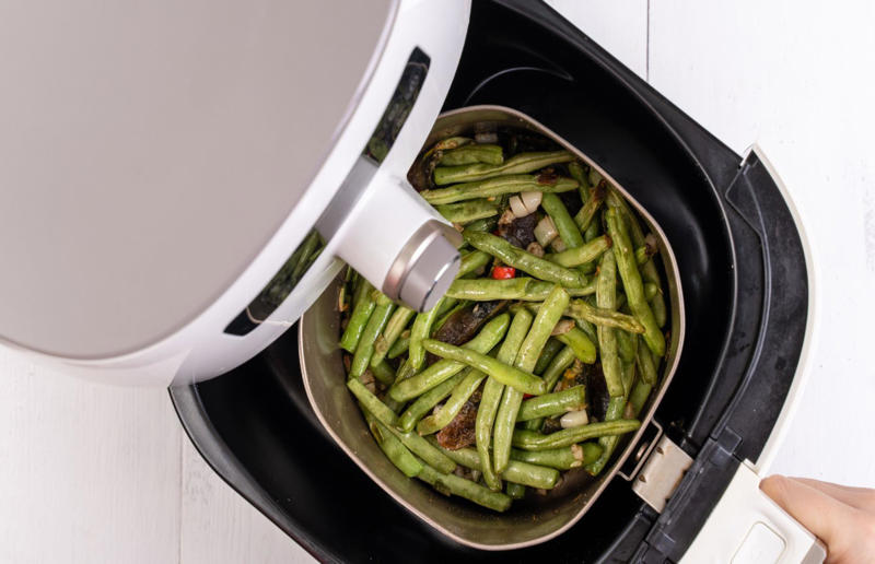 Only cooking fresh vegetables Air fryer errors, Over-filling the basket, Forgetting to clean after each use, Not giving your air fryer enough space, Buying the wrong size, Neglecting to preheat your air fryer, Treating it like a conventional oven, Not checking food as it cooks, Skipping the oil, Using the wrong setting, Lining the whole basket, Not using a liner at all, Allowing your food to stick to the basket, Not soaking your chips first, Trying to make toast, Failing to shake the basket during cooking, Forgetting to flip food halfway through cooking, Cooking food with wet or loose batters, Cooking breaded foods incorrectly, Adding cheese to burgers too soon, Attempting to cook popcorn, Trying to bake deep or large cakes, Not using it for muffins, Trying to cook leafy greens, Over (or under) cooking meat, Only cooking fresh vegetables, Losing out on leftovers, Not using it for frozen snacks