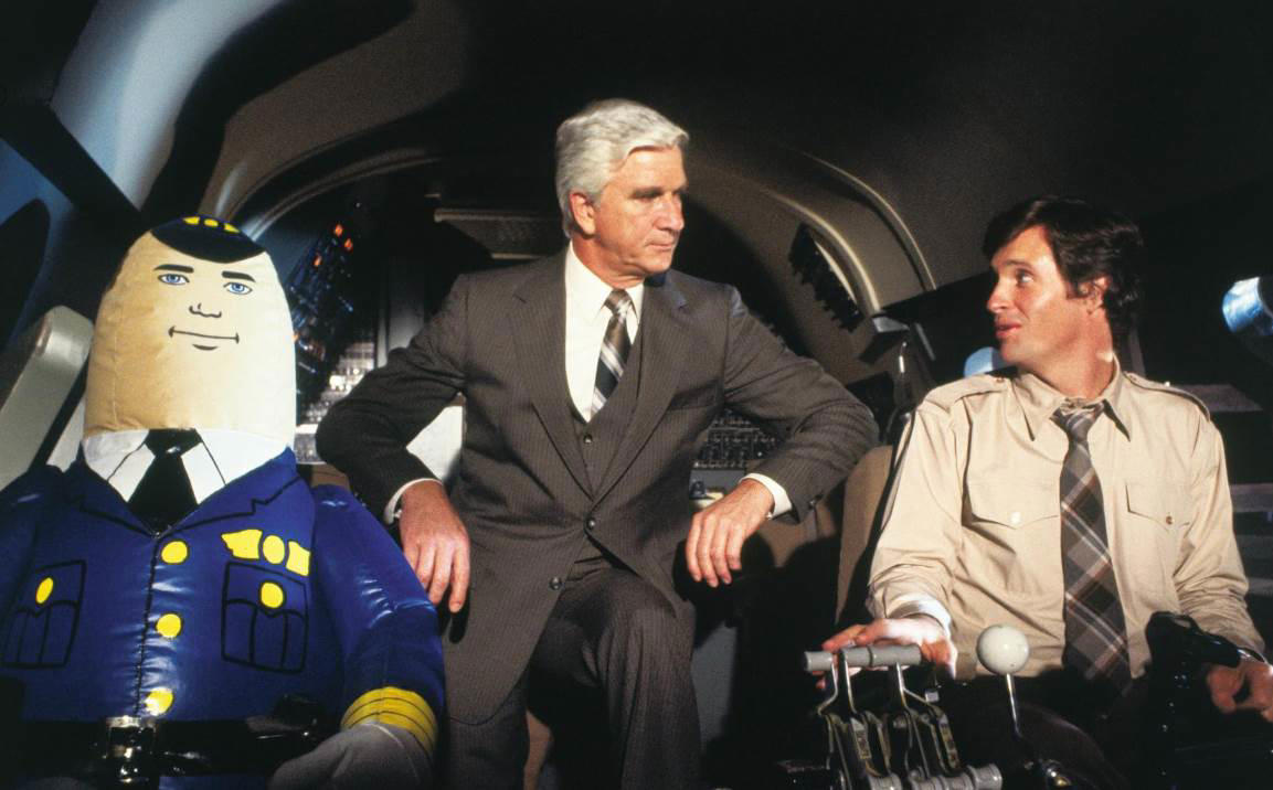 22. Airplane 60. Austin Powers: International Man of Mystery (1997), 59. Booksmart (2019), 58. Bill and Ted's Excellent Adventure (1989), 57. Planes, Trains and Automobiles (1987), 56. School of Rock, 55. The Blues Brothers, 54. Bridesmaids, 53. Talladega Nights: The Ballad of Ricky Bobby, 52. Office Space, 51. Billy Madison, 50. Tommy Boy, 49. The 40 Year Old Virgin, 48. Tootsie, 47. What We Do in the Shadows, 46. Wayne's World, 45. Deadpool, 44. Tropic Thunder, 43. Animal House, 42. The Hangover, 41. Hot Shots!, 40. Ferris Bueller's Day Off, 39. Zoolander, 38. High Fidelity, 37. Clerks, 36. Superbad, 35. Shaun of the Dead, 34. Happy Gilmore, 33. Knocked Up, 32. Meet the Parents, 31. Anchorman: The Legend of Ron Burgundy, 30. The Grand Budapest Hotel, 29. Hot Fuzz, 28. Airplane, 27. This Is Spinal Tap, 26. Borat, 25. The General, 24. There's Something About Mary, 23. The Apartment, 22. Top Secret!, 21. The Great Dictator, 20. Coming to America, 19. The Producers, 18. Manhattan, 17. Juno, 16. Young Frankenstein, 15. In Bruges, 14. Some Like It Hot, 13. Trading Places, 12. Modern Times, 11. Blazing Saddles, 10. Dumb and Dumber, 09. Midnight Run, 08. The Naked Gun, 07. Dr. Strangelove or: How I Learned to Stop Worrying and Love the Bomb, 06. Annie Hall, 05. Life of Brian, 04. Groundhog Day, 03. Ghostbusters, 02. The Big Lebowski, 01. Monty Python and the Holy Grail
