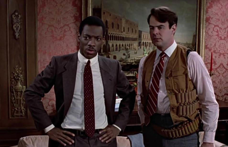 12. Trading Places 60. Austin Powers: International Man of Mystery (1997), 59. Booksmart (2019), 58. Bill and Ted's Excellent Adventure (1989), 57. Planes, Trains and Automobiles (1987), 56. School of Rock, 55. The Blues Brothers, 54. Bridesmaids, 53. Talladega Nights: The Ballad of Ricky Bobby, 52. Office Space, 51. Billy Madison, 50. Tommy Boy, 49. The 40 Year Old Virgin, 48. Tootsie, 47. What We Do in the Shadows, 46. Wayne's World, 45. Deadpool, 44. Tropic Thunder, 43. Animal House, 42. The Hangover, 41. Hot Shots!, 40. Ferris Bueller's Day Off, 39. Zoolander, 38. High Fidelity, 37. Clerks, 36. Superbad, 35. Shaun of the Dead, 34. Happy Gilmore, 33. Knocked Up, 32. Meet the Parents, 31. Anchorman: The Legend of Ron Burgundy, 30. The Grand Budapest Hotel, 29. Hot Fuzz, 28. Airplane, 27. This Is Spinal Tap, 26. Borat, 25. The General, 24. There's Something About Mary, 23. The Apartment, 22. Top Secret!, 21. The Great Dictator, 20. Coming to America, 19. The Producers, 18. Manhattan, 17. Juno, 16. Young Frankenstein, 15. In Bruges, 14. Some Like It Hot, 13. Trading Places, 12. Modern Times, 11. Blazing Saddles, 10. Dumb and Dumber, 09. Midnight Run, 08. The Naked Gun, 07. Dr. Strangelove or: How I Learned to Stop Worrying and Love the Bomb, 06. Annie Hall, 05. Life of Brian, 04. Groundhog Day, 03. Ghostbusters, 02. The Big Lebowski, 01. Monty Python and the Holy Grail