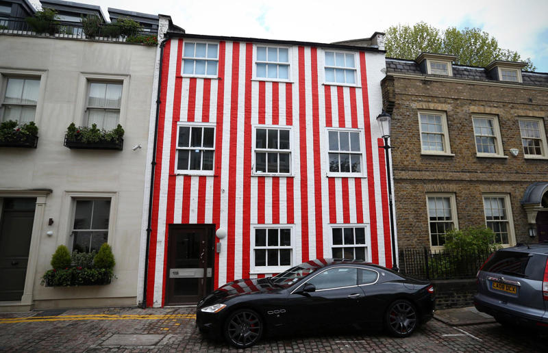 Woman gave house 'circus' makeover after planning complaints Surprising real estate spats from around the globe, Homeowner built fence through neighbour's swimming pool, Woman gave house 'circus' makeover after planning complaints, Ruffled residents take action against rowdy roosters, Man builds three-foot-wide house to block neighbour’s outlook, Goalkeeper took chainsaw to neighbour’s garage over obstructed view, Neighbours' tree cut in half over bird mess, Neighbours' tree cut in half over bird poo squabble, Millionaire couple sued by neighbours over supercar headache, Airbnb host riled neighbours with pink emoji paint job, Civil War veteran built skinny house to spite his brother, Vegan sued neighbours over barbecue smells, Neighbour filed noise complaint over rowdy sea lions, Disgruntled man listed part of homeowner's wall for £37k