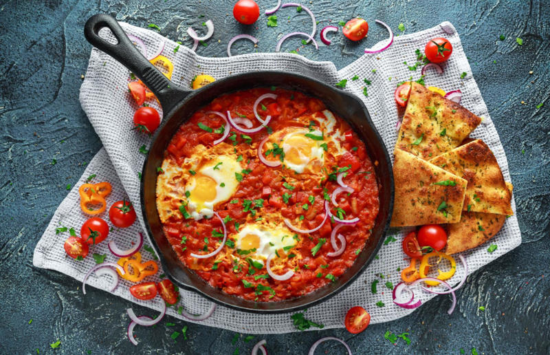 18. Shakshuka, North Africa 29. Tortilla de patatas, Spain, 28. Dublin coddle, Ireland, 27. Meatballs, Sweden, 26. Pierogi, Poland, 25. Wiener schnitzel, Austria, 24. Cheese fondue, Switzerland, 23. Bitterballen, Netherlands, 22. Congee, China, 21. Beef stroganoff, Russia, 20. Goulash, Hungary, 19. Sopa Azteca, Mexico, 18. Shakshuka, North Africa, 17. Spätzle, Germany, 16. Khichdi, India, 15. Bobotie, South Africa, 14. Feijoada, Brazil, 13. Kimchi-jjigae, South Korea, 12. Meat pies, Australia, 11. Poutine, Canada, 10. Shepherd's pie, UK and Ireland, 9. Koshary, Egypt, 8. Mac 'n' cheese, USA, 7. Curry udon, Japan, 6. Borscht, Ukraine, 5. Moussaka, Greece, 4. Onion soup, France, 3. Fish and chips, UK, 2. Grilled cheese sandwich, USA