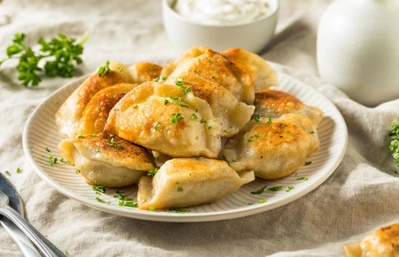 26. Pierogi, Poland 29. Tortilla de patatas, Spain, 28. Dublin coddle, Ireland, 27. Meatballs, Sweden, 26. Pierogi, Poland, 25. Wiener schnitzel, Austria, 24. Cheese fondue, Switzerland, 23. Bitterballen, Netherlands, 22. Congee, China, 21. Beef stroganoff, Russia, 20. Goulash, Hungary, 19. Sopa Azteca, Mexico, 18. Shakshuka, North Africa, 17. Spätzle, Germany, 16. Khichdi, India, 15. Bobotie, South Africa, 14. Feijoada, Brazil, 13. Kimchi-jjigae, South Korea, 12. Meat pies, Australia, 11. Poutine, Canada, 10. Shepherd's pie, UK and Ireland, 9. Koshary, Egypt, 8. Mac 'n' cheese, USA, 7. Curry udon, Japan, 6. Borscht, Ukraine, 5. Moussaka, Greece, 4. Onion soup, France, 3. Fish and chips, UK, 2. Grilled cheese sandwich, USA