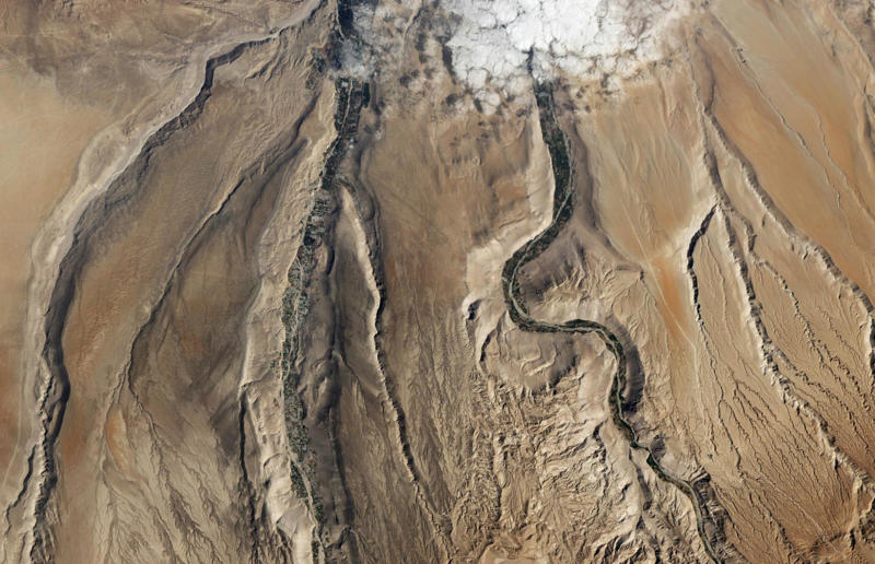Lluta River, Atacama Desert, Chile High art, Mine in Xinjiang, China, Mountain pass in Transylvania, Romania, Greenland ice sheet, Lluta River, Atacama Desert, Chile, The Dead Sea, Israel and Jordan, Terraced rice fields in Vietnam, Bangkok interchange, Thailand, Pink Lake in Western Australia, The Great Barrier Reef, Australia, Los Angeles container port, USA, A solar farm in California, USA, Kazakhstan farmland in the autumn, Phytoplankton bloom in the Barents Sea, Russia, Staircase in the Vatican Museums, Italy, Hallstatt in winter, Austria, The Nile in Egypt, Bangkok's Ratchada Train Market, Thailand, England's Chalk Horse, UK, Jodhpur, India, Okavango Delta, Botswana, The Italian countryside, Tuscany, The Italian countryside, Pavia, The Nazca Lines in Peru, Yellowstone National Park, Wyoming, USA, Abandoned Housing Development in Phoenix, Arizona, USA, Holmes Beach on Anna Maria Island in Florida, USA, Orchard near Siem Reap, Cambodia, Sand dune in the Namib Desert, Namibia