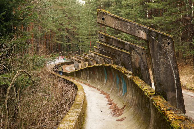 Abandoned places that will give you the chills, Old City Hall Station, 1984 Olympic venues, Ta Prohm Temple, The Pines, Michigan Central Station, Bombay Beach, Hashima Island, Old Cahawba, Castle Frankenstein, Iron Goat Trail, SS Ayrfield, Bedrock City, Gwynned slate quarries, The Astrodome, Seattle Underground, Tillamook Lighthouse, 29 Buffalo Central Terminal, Rhyolite, Presidio Modelo, Cementerio de Trenes, Kolmanskop, Old stairway at Bankhead, Gereja Ayam, St. Kilda, Canfranc railway station, Poveglia, Cape Romano dome house