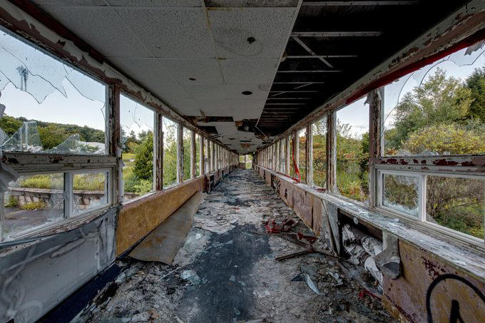 Abandoned places that will give you the chills, Old City Hall Station, 1984 Olympic venues, Ta Prohm Temple, The Pines, Michigan Central Station, Bombay Beach, Hashima Island, Old Cahawba, Castle Frankenstein, Iron Goat Trail, SS Ayrfield, Bedrock City, Gwynned slate quarries, The Astrodome, Seattle Underground, Tillamook Lighthouse, 29 Buffalo Central Terminal, Rhyolite, Presidio Modelo, Cementerio de Trenes, Kolmanskop, Old stairway at Bankhead, Gereja Ayam, St. Kilda, Canfranc railway station, Poveglia, Cape Romano dome house