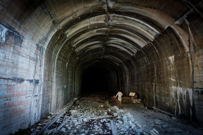 Abandoned places that will give you the chills, Old City Hall Station, 1984 Olympic venues, Ta Prohm Temple, The Pines, Michigan Central Station, Bombay Beach, Hashima Island, Old Cahawba, Castle Frankenstein, Iron Goat Trail, SS Ayrfield, Bedrock City, Gwynned slate quarries, The Astrodome, Seattle Underground, Tillamook Lighthouse, 29 Buffalo Central Terminal, Rhyolite, Presidio Modelo, Cementerio de Trenes, Kolmanskop, Old stairway at Bankhead, Gereja Ayam, St. Kilda, Canfranc railway station, Poveglia, Cape Romano dome house