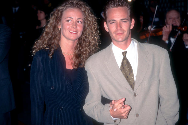 Gone too soon, Luke got lucky when he landed a role on 'Beverly Hills, 90210', Dylan McKay the bad boy everyone loved, Luke was one of THE 90s heartthrobs, Luke took a break from '95-'98 to work on movies, But Luke couldn't resist returning to '90210', Luke marries and becomes a father, Luke struggled to find the same degree of success after '90210', Luke landed starring roles but the shows didn't last long..., Broadway and theatre in London, Luke was even in a Swedish comedy in the mid-2000s, A health scare in 2015, Perry began advocacy work, Luke found his place again on 'Riverdale', Luke Perry wanted to do a reboot of '90210', A reboot in the works??, Fans were thrilled, ...but Luke had a conflict due to his contract with 'Riverdale', Tragedy strikes, Luke was 52 when he passed away, Perry's final role was in a Tarantino film, Luke was secretly engaged at the time of his death, They were said to be "smitten", An icon that is dearly missed