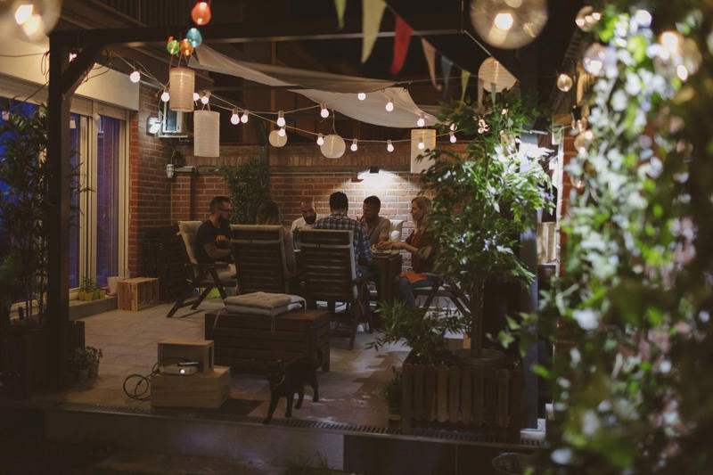1) Opt for Comfortable Seating, 2) Add Soft Lighting, 3) Pile On the Throws, 4) Put Down a Rug, 5) Add a Fire Pit, 6) Incorporate a Water Feature, 7) Splurge on a Heat Lamp, 8) Make it Feel Secluded, 9) Throw in Some Color, 10) Offer a Variety of Seating Options, 11) Add Some Greenery, 12) Spring for the Hot Tub