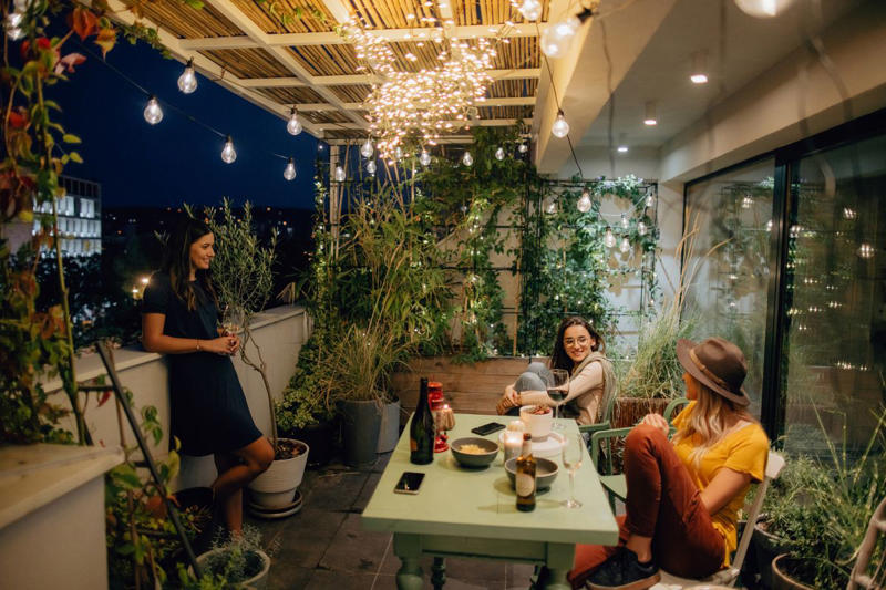1) Opt for Comfortable Seating, 2) Add Soft Lighting, 3) Pile On the Throws, 4) Put Down a Rug, 5) Add a Fire Pit, 6) Incorporate a Water Feature, 7) Splurge on a Heat Lamp, 8) Make it Feel Secluded, 9) Throw in Some Color, 10) Offer a Variety of Seating Options, 11) Add Some Greenery, 12) Spring for the Hot Tub