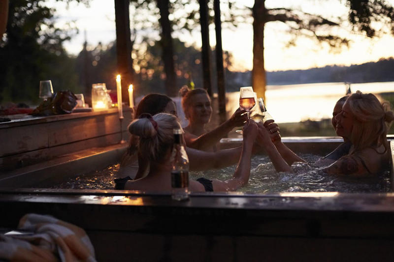1) Opt for Comfortable Seating, 2) Add Soft Lighting, 3) Pile On the Throws, 4) Put Down a Rug, 5) Add a Fire Pit, 6) Incorporate a Water Feature, 7) Splurge on a Heat Lamp, 8) Make it Feel Secluded, 9) Throw in Some Color, 10) Offer a Variety of Seating Options, 11) Add Some Greenery, 12) Spring for the Hot Tub