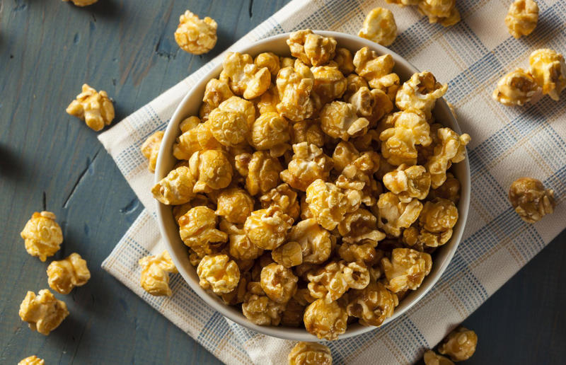 25. Say yes to soy sauce on popcorn 67. Give breadcrumbs extra flavour, 66. Improve a boxed cake mix, 65. Warm a knife for neat slicing, 64. Make French toast in the slow cooker, 63. Ripen bananas slowly with a banana hanger, 62. Make dressing with almost-empty jars, 61. Use overripe bananas for the best banana bread, 60. Use vegetable water in gravy, 59. Add nutritional yeast for a cheesy flavour, 58. Combine miso and butter for a flavour hit, 57. Make frozen coffee cubes, 56. Pair your pasta and sauce correctly, 55. Keep baked goods soft with a slice of bread, 54. Use ice cube trays to freeze leftover sauce, 53. Use an ice cream scoop for meatballs, 52. Add sugar to savoury dishes and salt to sweet, 51. Peel tomatoes like a pro, 50. Prep ahead for smoothies, 49. Apply baking soda to stained food storage containers, 48. Try the hedgehog mango trick, 47. Stop syrup sticking to your spoons, 46. Use carbonated drinks for lighter batter, 45. Be creative with ketchup, 44. Buy ovenproof storage containers, 43. Sweeten tomato sauce with a carrot, 42. Make and freeze breakfast burritos, 41. Bulk out sauces with lentils, 40. Mix it up with a mug omelette, 39. Blanch your vegetables, 38. Use orange juice in marinades, 37. Put pasta water to good use, 36. Add beetroot to brownies, 35. Use a cupcake tin for egg muffins, 34. Roast potatoes in mayonnaise, 33. Raise your mac 'n' cheese game with mustard, 32. Score meat skin, 31. Ditch the oven for mug cakes, 30. Freeze fresh ginger, 29. Massage kale, 28. Use bread to stop your sugar clumping, 27. Froth milk the easy way, 26. Say yes to soy sauce on popcorn, 25. Use the microwave to peel garlic, 24. Cook bacon in the microwave, 23. Stop soggy sandwiches, 22. Separate onions and potatoes, 21. Use the float test for eggs, 20. Transform cake fails, 19. Use bicarbonate of soda to tenderise meat, 18. Store herby butter in the freezer, 17. Reuse sauce bottles for pancakes, 16. Turn your peanut butter jar upside down, 15. Stop using boiling water for coffee, 14. Use a hand mixer for mashed potatoes, 13. Microwave pizza with water, 12. Grate butter for easy spreading, 11. Microwave lemons to get more juice, 10. Make hash browns in your waffle iron, 9. Use a wine bottle as a rolling pin, 8. Use mayonnaise for perfect toasties, 7. Revive old bread with water, 6. Use your microwave for baked potatoes, 5. Rescue burnt biscuits with a grater, 4. Salvage split Hollandaise, 3. Poach eggs in cling film, 2. Store herbs like flowers