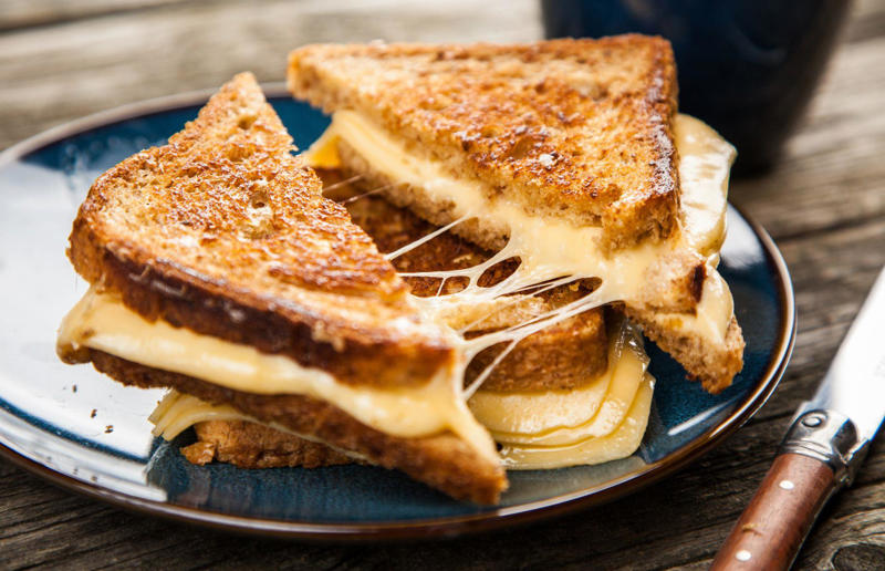 8. Use mayonnaise for perfect toasties 67. Give breadcrumbs extra flavour, 66. Improve a boxed cake mix, 65. Warm a knife for neat slicing, 64. Make French toast in the slow cooker, 63. Ripen bananas slowly with a banana hanger, 62. Make dressing with almost-empty jars, 61. Use overripe bananas for the best banana bread, 60. Use vegetable water in gravy, 59. Add nutritional yeast for a cheesy flavour, 58. Combine miso and butter for a flavour hit, 57. Make frozen coffee cubes, 56. Pair your pasta and sauce correctly, 55. Keep baked goods soft with a slice of bread, 54. Use ice cube trays to freeze leftover sauce, 53. Use an ice cream scoop for meatballs, 52. Add sugar to savoury dishes and salt to sweet, 51. Peel tomatoes like a pro, 50. Prep ahead for smoothies, 49. Apply baking soda to stained food storage containers, 48. Try the hedgehog mango trick, 47. Stop syrup sticking to your spoons, 46. Use carbonated drinks for lighter batter, 45. Be creative with ketchup, 44. Buy ovenproof storage containers, 43. Sweeten tomato sauce with a carrot, 42. Make and freeze breakfast burritos, 41. Bulk out sauces with lentils, 40. Mix it up with a mug omelette, 39. Blanch your vegetables, 38. Use orange juice in marinades, 37. Put pasta water to good use, 36. Add beetroot to brownies, 35. Use a cupcake tin for egg muffins, 34. Roast potatoes in mayonnaise, 33. Raise your mac 'n' cheese game with mustard, 32. Score meat skin, 31. Ditch the oven for mug cakes, 30. Freeze fresh ginger, 29. Massage kale, 28. Use bread to stop your sugar clumping, 27. Froth milk the easy way, 26. Say yes to soy sauce on popcorn, 25. Use the microwave to peel garlic, 24. Cook bacon in the microwave, 23. Stop soggy sandwiches, 22. Separate onions and potatoes, 21. Use the float test for eggs, 20. Transform cake fails, 19. Use bicarbonate of soda to tenderise meat, 18. Store herby butter in the freezer, 17. Reuse sauce bottles for pancakes, 16. Turn your peanut butter jar upside down, 15. Stop using boiling water for coffee, 14. Use a hand mixer for mashed potatoes, 13. Microwave pizza with water, 12. Grate butter for easy spreading, 11. Microwave lemons to get more juice, 10. Make hash browns in your waffle iron, 9. Use a wine bottle as a rolling pin, 8. Use mayonnaise for perfect toasties, 7. Revive old bread with water, 6. Use your microwave for baked potatoes, 5. Rescue burnt biscuits with a grater, 4. Salvage split Hollandaise, 3. Poach eggs in cling film, 2. Store herbs like flowers