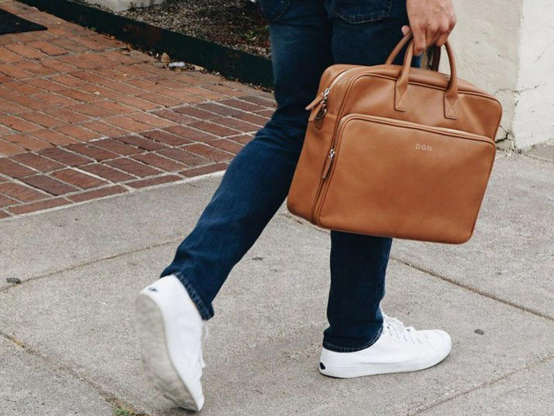A fancy messenger bag A starter watch, A pillow that pays homage to their alma mater, A stylish suitcase, A nice set of dinnerware, A history of their favorite football team, A set of glasses full of school spirit, The newest AirPods, A pleasant way to wake up every day, A toiletry bag to use at home or for travel, A fancy messenger bag, A made-to-measure suit, A handheld massager, A pair of joggers he can wear anywhere, A must-read financial guide book, A food delivery gift card, A customized business card holder, A wireless charging pad, An even easier way to make pasta, A durable mug made for camping and beyond, A new skincare routine, A small but powerful speaker, A speaker that talks to you, A fun mug, An Amazon gift card