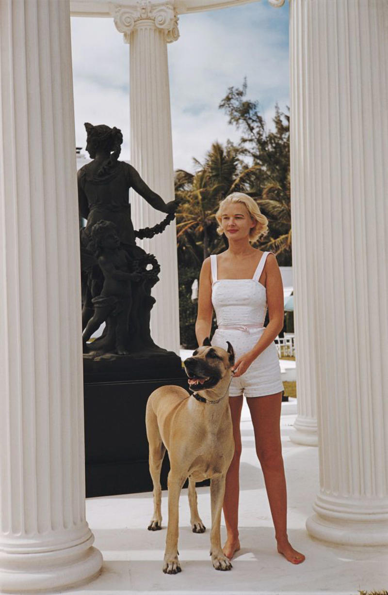 1940: A Glamorous Duo, 1946: A Beach Stroll, 1946: Under the Palm Trees, 1946: A Winter Getaway, 1948: A Fishing Trip, 1953: Street View, 1954: A Day at the Beach, 1955: A Slim Aarons Snapshot, 1955: Sketching by the Beach, 1955: Walking the Dog, 1955: Pretty in Pink, 1955: A Polo Ball, 1955: Worth Avenue, 1955: Evening Elegance, 1955: Luxury Living, 1955: Sipping Champagne, 1956: La Coquille Club, 1958: Glamorous in Chiffon, 1959: Sitting by the Pool, 1959: A Walk on the Wild Side, 1961: The Colony Hotel, 1961: A Pool Party, 1961: A Fashionable Affair, 1964: A Vibrant Duo, 1964: Lilly Pulitzer Designs, 1968: Athina Livanos Onassis, 1968: Outside the Flagler Museum, 1970: A Motorcycle Ride, 1970: A Painted Portrait in Palm Beach, 1970: Pretty Patterns, 1982: Picture-Perfect Palm Beach Home