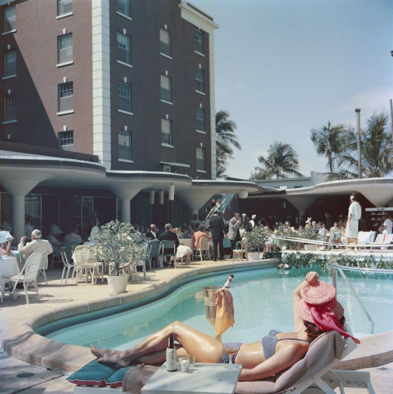 1940: A Glamorous Duo, 1946: A Beach Stroll, 1946: Under the Palm Trees, 1946: A Winter Getaway, 1948: A Fishing Trip, 1953: Street View, 1954: A Day at the Beach, 1955: A Slim Aarons Snapshot, 1955: Sketching by the Beach, 1955: Walking the Dog, 1955: Pretty in Pink, 1955: A Polo Ball, 1955: Worth Avenue, 1955: Evening Elegance, 1955: Luxury Living, 1955: Sipping Champagne, 1956: La Coquille Club, 1958: Glamorous in Chiffon, 1959: Sitting by the Pool, 1959: A Walk on the Wild Side, 1961: The Colony Hotel, 1961: A Pool Party, 1961: A Fashionable Affair, 1964: A Vibrant Duo, 1964: Lilly Pulitzer Designs, 1968: Athina Livanos Onassis, 1968: Outside the Flagler Museum, 1970: A Motorcycle Ride, 1970: A Painted Portrait in Palm Beach, 1970: Pretty Patterns, 1982: Picture-Perfect Palm Beach Home