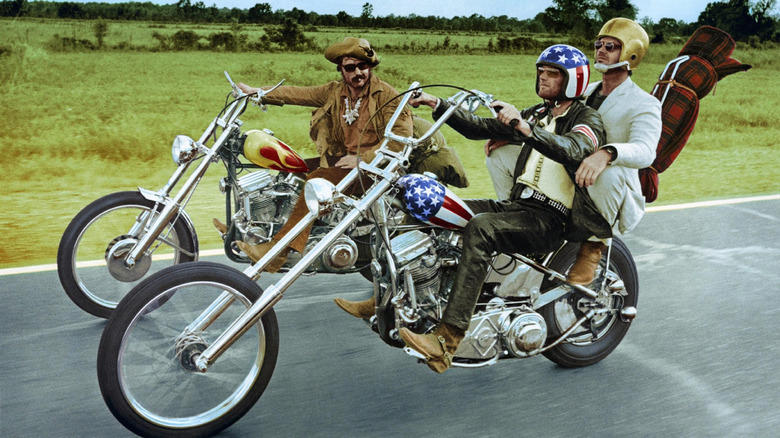 Dennis Hopper, Peter Fonda, and Jack Nicholson in Easy Rider, Zed's Harley-Davidson FXR Super Glide Chopper — Pulp Fiction, Chino's Harley-Davidson Hydra-Glide — The Wild One, Johnny Blaze's Harley-Davidson Panhead — Ghost Rider, T-800's Harley-Davidson Fat Boy — Terminator 2, Wyatt's Harley-Davidson Captain America Chopper — Easy Rider, Rocky Balboa's Harley-Davidson FLH 80 — Rocky III, Jax Teller's Harley-Davidson FXD Dyna Super Glide — Sons of Anarchy, Hobbs' Harley-Davidson Softail — Hobbs and Shaw, Captain America's Harley-Davidson WLA Liberator — Captain America: The First Avenger, Fonz's Harley-Davidson Knucklehead — Happy Days