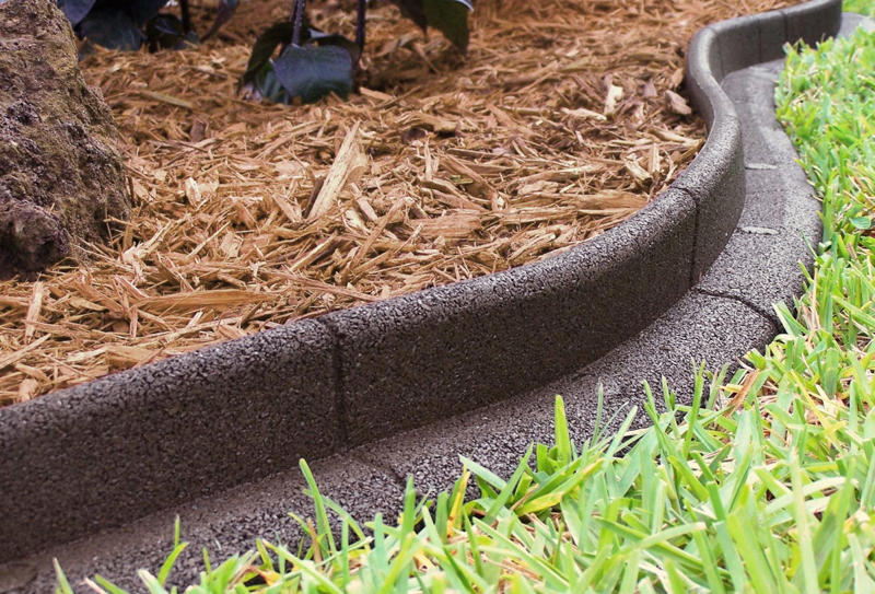 Why Edging Matters, Types of Edging, Free: Hand Edging, Almost Free: Glass Bottle Edging , Practically Free: Natural Log Edging, Inexpensive: Plastic Edging, Inexpensive: Woven Willow Edging, Inexpensive: Cedar Edging, Inexpensive: Landscape Timber Edging, Inexpensive: Bamboo Edging, Inexpensive: Pound-In Plastic Edging, Inexpensive: Metal Edging, Less Expensive: Scalloped Terracotta Edging, Less Expensive: Brick Edging, Less Expensive: Eucalyptus Wood Border Edging, Less Expensive: Grass and Shrub Edging, Less Expensive: Mixed Plant Edging,  Less Expensive: Gravel Edging, Less Expensive: Recycled Rubber Edging, Less Expensive: Stone and Gravel Edging, Less Expensive: Stone Pillar Edging , Moderately Expensive: Tidy Living Hedge Edging, Moderately Expensive: Weathering Steel Edging, Moderately Expensive: Paver Stone Edging, Moderately Expensive: Flagstone Edging, Expensive: Concrete Wall Edging, Expensive: Brick Wall Edging, Expensive: Decorative Fence Edging, Expensive: Raised-Garden Bed Edging, Expensive: Poured Concrete Edging, Various Prices: Natural Rock Edging, Various Prices: Antique Ironwork Border