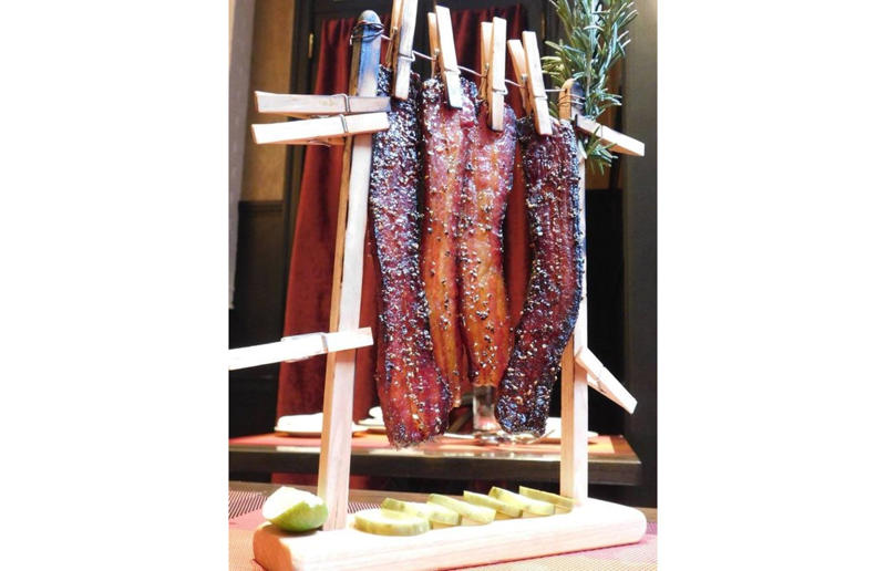 New York: Clothesline Bacon, David Burke Tavern, New York City Bacon with EVERYTHING, Alabama: BALT, Urban Cookhouse, various locations, Alaska: Fat Elvis milkshake, Snow City Cafe, Anchorage, Arizona: stuffed Medjool dates, J.T. Prime Kitchen & Cocktails, Yuma, Arkansas: Eggniter, Golden Kolache Bakery, Fayetteville, California: B’B’B’ Bacon, Slater's 50/50, various locations, Colorado: signature bacon flight, Bacon Social House, various locations, Connecticut: smoked mac & cheese, Pig Rig BBQ, Wallingford, Delaware: bacon cheese fries, m2o Burgers & Salads, Newark, District of Columbia: glazed bacon lollis, Founding Farmers, various locations, Florida: candied bacon maple ice cream, Ulele, Tampa, Georgia: BBQ bacon, Burger 21, Kennesaw and Buford, Hawaii: Fat Boy, Hank's Haute Dogs, Honolulu, Idaho: bacon, egg, and cheese breakfast tacos, Tin Roof Tacos, various locations, Illinois: cheeseburger, Au Cheval, Chicago, Indiana: BLT croissant, Rize, various locations, Iowa: pancake sandwich, The Breakfast Club, various locations, Kansas: bleu cheese and bacon burger, The Anchor, Wichita, Kentucky: maple bacon donut, Nord's Bakery, Louisville, Louisiana: Buckboard Bacon Melt, Cochon Butcher, New Orleans, Maine: bacon Cheddar, The Holy Donut, Portland, Maryland: Baltimore Burger, Abbey Burger Bistro, Baltimore and Havre de Grace, Massachusetts: 'Irish' nachos, Harry's Bar & Grill, Boston, Michigan: BLT, Tony’s I-75, Birch Run, Minnesota: Millionaire bacon burger, Granite City Food & Brewery, various locations, Mississippi: Redneck Benny, Big Bad Breakfast, Oxford, Missouri: The Combo, Songbird, St. Louis, Montana: The 'Mazatlan' Mexican Dog, The Burger Dive, Billings, Nebraska: Greatest Burger Ever, Honest Abe’s Burgers & Freedom, Lincoln, Nebraska, Nevada: 24K Burger, Slater's 50/50, Las Vegas, New Hampshire: Bacon Bene, The Bacon Barn, Londonderry, New Jersey: bacon brisket sandwich, Bake'n Bacon, Cape May, New Mexico: BB&C, Urban Hotdog Company, Albuquerque, New York: Clothesline Bacon, David Burke Tavern, New York City, North Carolina: BLT, Merritt's Grill, Chapel Hill, North Dakota: The Elvis, Bearscat Bakehouse, Bismarck and Minot, Ohio: Biscuit BLT, Dough Mama, Columbus, Oklahoma: Brussels sprouts, Packard’s, Oklahoma City, Oregon: praline bacon, Screen Door, Portland, Pennsylvania: bacon flight, Bacon, Bourbon & Beer, Washington, Rhode Island: BLT, The Malted Barley, Providence, South Carolina: candied bacon brownie, Nose Dive, Greenville, South Dakota: bacon wrapped filet mignon, Alpine Inn, Hill City, Tennessee: Southern Sampler Breakfast, The Loveless Cafe, Nashville, Texas: chicken fried bacon, Sodolak's Original Country Inn, Snook, Utah: roasted bacon wrapped dates, Midway Mercantile Restaurant, Midway, Vermont: Breakfast Mac, Our House Bistro, Winooski, Virginia: Mother Clucker, Capitol Waffle Shop, various locations, Washington: Meatza, Windy City Pie, Seattle, West Virginia: hot chicken sandwich with bacon, Wood Iron Eatery, Fayetteville, Wisconsin: tequila jam burger, 11:11 Burgers & Beignets, Fond Du Lac, Wisconsin