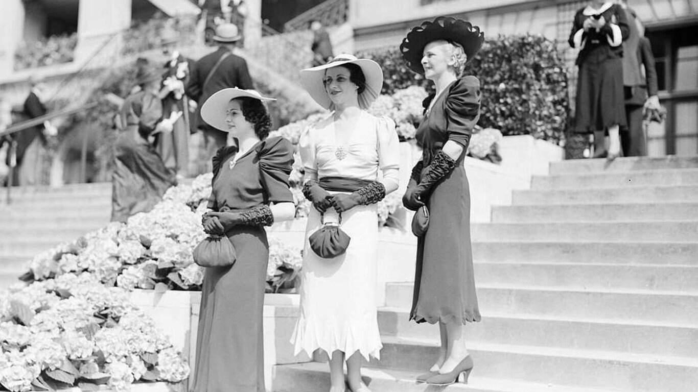 1. Three models with hats by Hélène Sorbier 1. Three models with hats by Hélène Sorbier, 2. People celebrating New Year’s Eve at El Morocco in New York City, 3. Ernest Hemingway and Marlene Dietrich, 4. Three women modeling dresses by Marcelle Landowska, 5. Lady smiling for a portrait, 6. Family of four listening to the radio, 7. German film director Fritz Lang, 9. Stepping out for a spring fashion parade in Brisbane, Australia, 10. Jean Harlow with Marcel Waves, 11. Conductors Serge Koussevitsky (left) and Sir Thomas Beecham, 12. Models with an audience in Paris, 13. American cartoonist and fashion designer Gladys Parker, 14. Three women with hats in Paris, 15. Golfer Bobby Jones (right) with the Walker Cup in Sandwich, England, 16. Models posing for a fashion shoot, 17. Modeling dresses by Hélène Sorbier in Paris, 18. German industrialist and arms manufacturer Gustav Krupp von Bohlen und Halbach (second from right) with his extended family, 19. A model in Paris, 20. Louisiana governor and senator Huey Long at a radio broadcast, 21. Brazilian politician Getúlio Vargas, 22. A model at the House of Paquin in Paris, 23. Two models in suits in Paris, 24. Austrian doctor and psychotherapist Alfred Adler, 25. Boxer Jack Dempsey, 26. British politician James Thomas (center) and friends, 27. Posing outside a cat show at the Salle Wagram, Paris, 28. Miss France, 29. Attorney Clarence Darrow (right), 30. Model De Decker with hat, 31. Actresses Laurette Taylor (left) and Ethel Barrymore, 32. Model De Decker with another hat, 33. Two models with hats in Paris, 34. Model Eliane Richer with hat, 35. Austrian-born actor and director Erich Von Stroheim, 36. Model Hélène Sorbier with hat, 37. Douglas Fairbanks Jr. (left), Charlie Chaplin, and Mary Pickford, 38. Fashion models, 39. Model in long dress with hat, 40. Models in a Red Bug Electric Roadster car at the Edison Electrical Exposition in New York, 41. Model with a hat, 42. Gary Cooper (right) and a location caterer on the set of “The Spoilers”, 43. A reception for golfer Bobby Jones after his British Open victory, 44. Model in a dress, 45. British photographer and costume designer Cecil Beaton, 46. Business mogul and multimillionaire John D. Rockefeller, 47. Five college girls jumping in winter clothes, 48. Model Hélène Sorbier with hat, 49. Model in a summer dress with hat, 50. Businessman and philanthropist Simon Guggenheim, 51. Diplomats from Czechoslovakia, Romania, and Yugoslavia at a Little Entente conference in Belgrade, 52. Model with a hat in Paris, 53. Woman standing outside