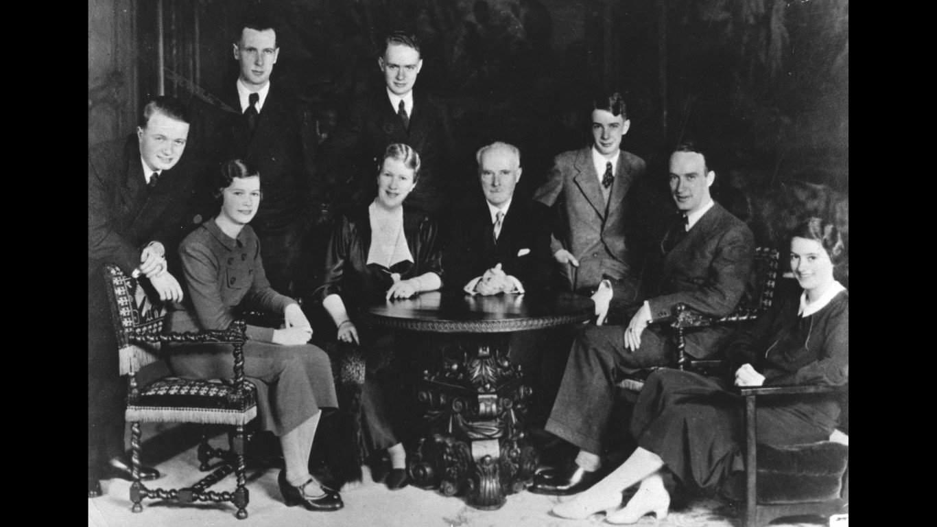 18. German industrialist and arms manufacturer Alfred Krupp (second from right) with his extended family 1. Three models with hats by Hélène Sorbier, 2. People celebrating New Year’s Eve at El Morocco in New York City, 3. Ernest Hemingway and Marlene Dietrich, 4. Three women modeling dresses by Marcelle Landowska, 5. Lady smiling for a portrait, 6. Family of four listening to the radio, 7. German film director Fritz Lang, 9. Stepping out for a spring fashion parade in Brisbane, Australia, 10. Jean Harlow with Marcel Waves, 11. Conductors Serge Koussevitsky (left) and Sir Thomas Beecham, 12. Models with an audience in Paris, 13. American cartoonist and fashion designer Gladys Parker, 14. Three women with hats in Paris, 15. Golfer Bobby Jones (right) with the Walker Cup in Sandwich, England, 16. Models posing for a fashion shoot, 17. Modeling dresses by Hélène Sorbier in Paris, 18. German industrialist and arms manufacturer Gustav Krupp von Bohlen und Halbach (second from right) with his extended family, 19. A model in Paris, 20. Louisiana governor and senator Huey Long at a radio broadcast, 21. Brazilian politician Getúlio Vargas, 22. A model at the House of Paquin in Paris, 23. Two models in suits in Paris, 24. Austrian doctor and psychotherapist Alfred Adler, 25. Boxer Jack Dempsey, 26. British politician James Thomas (center) and friends, 27. Posing outside a cat show at the Salle Wagram, Paris, 28. Miss France, 29. Attorney Clarence Darrow (right), 30. Model De Decker with hat, 31. Actresses Laurette Taylor (left) and Ethel Barrymore, 32. Model De Decker with another hat, 33. Two models with hats in Paris, 34. Model Eliane Richer with hat, 35. Austrian-born actor and director Erich Von Stroheim, 36. Model Hélène Sorbier with hat, 37. Douglas Fairbanks Jr. (left), Charlie Chaplin, and Mary Pickford, 38. Fashion models, 39. Model in long dress with hat, 40. Models in a Red Bug Electric Roadster car at the Edison Electrical Exposition in New York, 41. Model with a hat, 42. Gary Cooper (right) and a location caterer on the set of “The Spoilers”, 43. A reception for golfer Bobby Jones after his British Open victory, 44. Model in a dress, 45. British photographer and costume designer Cecil Beaton, 46. Business mogul and multimillionaire John D. Rockefeller, 47. Five college girls jumping in winter clothes, 48. Model Hélène Sorbier with hat, 49. Model in a summer dress with hat, 50. Businessman and philanthropist Simon Guggenheim, 51. Diplomats from Czechoslovakia, Romania, and Yugoslavia at a Little Entente conference in Belgrade, 52. Model with a hat in Paris, 53. Woman standing outside