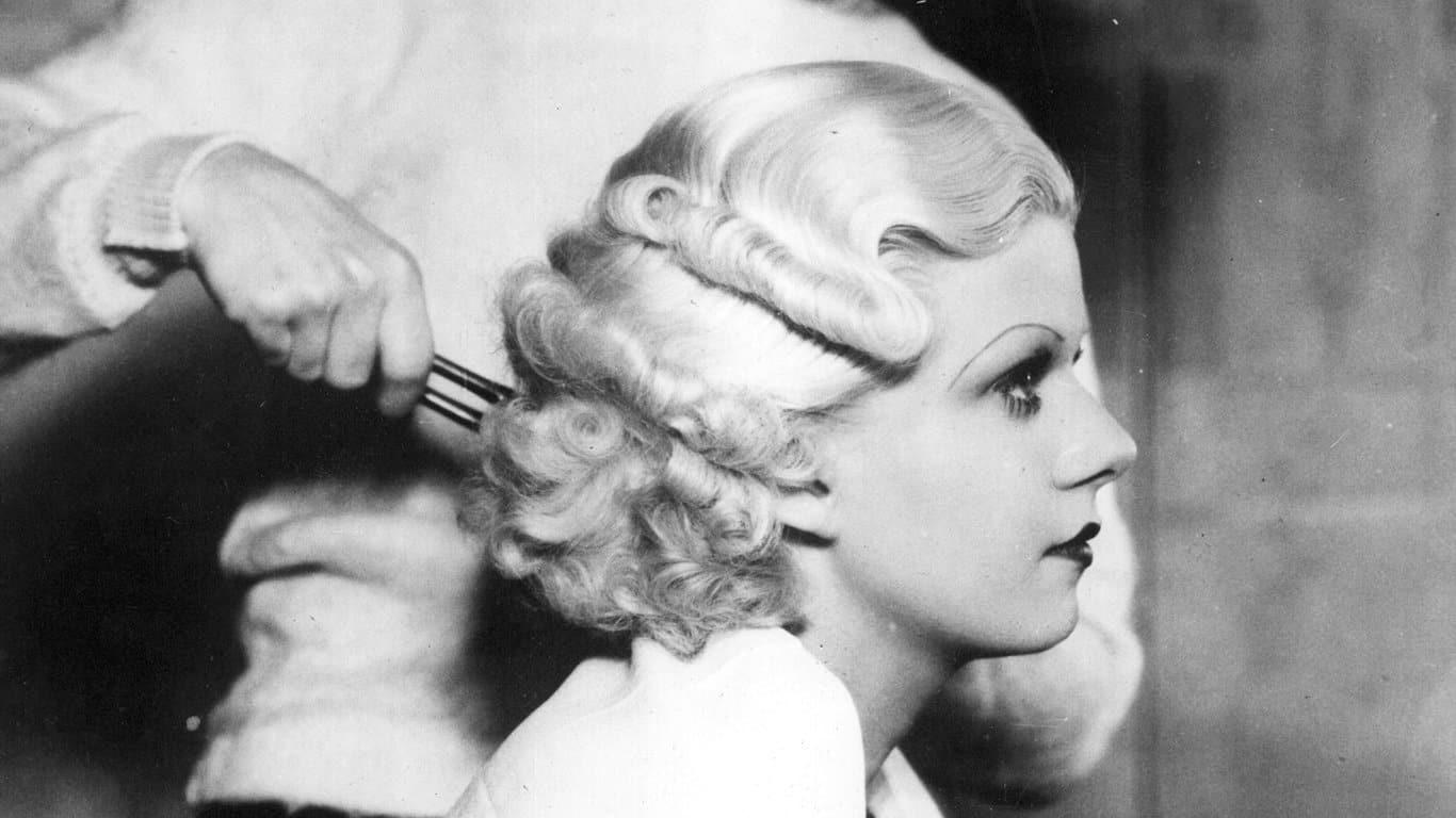 10. Jean Harlow with Marcel Waves 1. Three models with hats by Hélène Sorbier, 2. People celebrating New Year’s Eve at El Morocco in New York City, 3. Ernest Hemingway and Marlene Dietrich, 4. Three women modeling dresses by Marcelle Landowska, 5. Lady smiling for a portrait, 6. Family of four listening to the radio, 7. German film director Fritz Lang, 9. Stepping out for a spring fashion parade in Brisbane, Australia, 10. Jean Harlow with Marcel Waves, 11. Conductors Serge Koussevitsky (left) and Sir Thomas Beecham, 12. Models with an audience in Paris, 13. American cartoonist and fashion designer Gladys Parker, 14. Three women with hats in Paris, 15. Golfer Bobby Jones (right) with the Walker Cup in Sandwich, England, 16. Models posing for a fashion shoot, 17. Modeling dresses by Hélène Sorbier in Paris, 18. German industrialist and arms manufacturer Gustav Krupp von Bohlen und Halbach (second from right) with his extended family, 19. A model in Paris, 20. Louisiana governor and senator Huey Long at a radio broadcast, 21. Brazilian politician Getúlio Vargas, 22. A model at the House of Paquin in Paris, 23. Two models in suits in Paris, 24. Austrian doctor and psychotherapist Alfred Adler, 25. Boxer Jack Dempsey, 26. British politician James Thomas (center) and friends, 27. Posing outside a cat show at the Salle Wagram, Paris, 28. Miss France, 29. Attorney Clarence Darrow (right), 30. Model De Decker with hat, 31. Actresses Laurette Taylor (left) and Ethel Barrymore, 32. Model De Decker with another hat, 33. Two models with hats in Paris, 34. Model Eliane Richer with hat, 35. Austrian-born actor and director Erich Von Stroheim, 36. Model Hélène Sorbier with hat, 37. Douglas Fairbanks Jr. (left), Charlie Chaplin, and Mary Pickford, 38. Fashion models, 39. Model in long dress with hat, 40. Models in a Red Bug Electric Roadster car at the Edison Electrical Exposition in New York, 41. Model with a hat, 42. Gary Cooper (right) and a location caterer on the set of “The Spoilers”, 43. A reception for golfer Bobby Jones after his British Open victory, 44. Model in a dress, 45. British photographer and costume designer Cecil Beaton, 46. Business mogul and multimillionaire John D. Rockefeller, 47. Five college girls jumping in winter clothes, 48. Model Hélène Sorbier with hat, 49. Model in a summer dress with hat, 50. Businessman and philanthropist Simon Guggenheim, 51. Diplomats from Czechoslovakia, Romania, and Yugoslavia at a Little Entente conference in Belgrade, 52. Model with a hat in Paris, 53. Woman standing outside