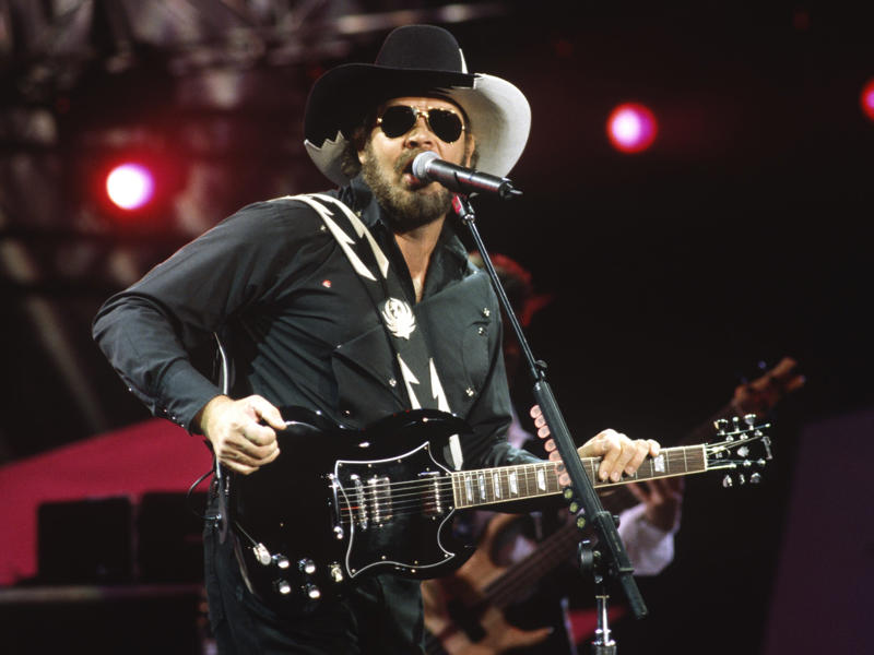 24. Hank Williams Jr. — 19.5 million units 25. Luke Bryan — 19 million units, 24. Hank Williams Jr. — 19.5 million units, 23. Brooks & Dunn — 21.5 million units, 22. Carrie Underwood — 22.5 million units, 21. Jimmy Buffett — 23 million units, 18. Vince Gill — 24 million units, 15. Linda Ronstadt — 30 million units, 14. Willie Nelson — 31.5 million units, 13. The Chicks — 33 million units, 12. John Denver — 33.5 million units, 11. Kenny Chesney — 35 million units, 8. Alan Jackson — 44.5 million units, 7. Kenny Rogers — 47.5 million units, 6. Shania Twain — 48 million units, 5. Alabama — 49 million units, 4. Taylor Swift — 57 million units, 3. George Strait — 69.5 million units, 2. Elvis Presley — 146.5 million units, 1. Garth Brooks — 162 million units