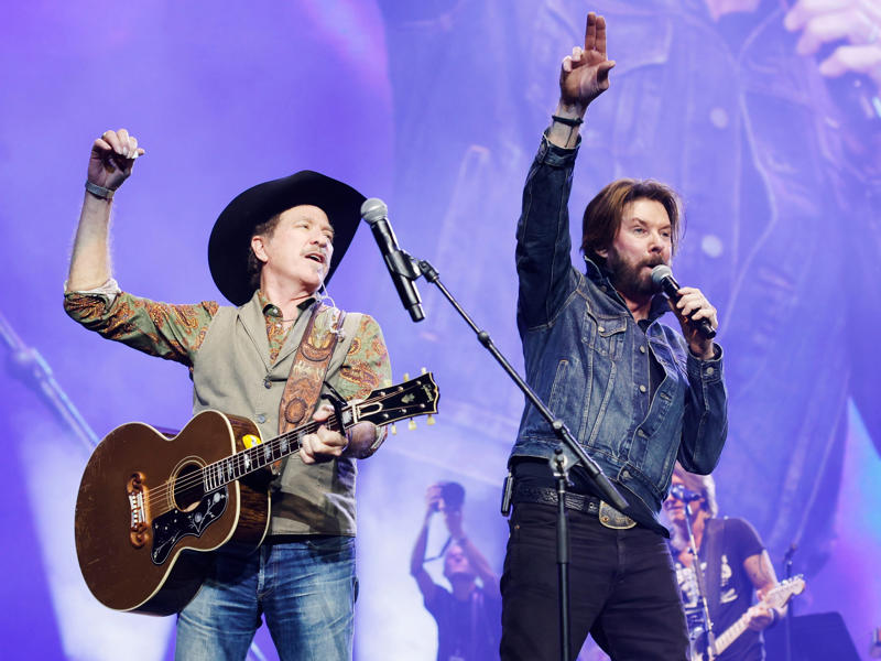 23. Brooks & Dunn — 21.5 million units 25. Luke Bryan — 19 million units, 24. Hank Williams Jr. — 19.5 million units, 23. Brooks & Dunn — 21.5 million units, 22. Carrie Underwood — 22.5 million units, 21. Jimmy Buffett — 23 million units, 18. Vince Gill — 24 million units, 15. Linda Ronstadt — 30 million units, 14. Willie Nelson — 31.5 million units, 13. The Chicks — 33 million units, 12. John Denver — 33.5 million units, 11. Kenny Chesney — 35 million units, 8. Alan Jackson — 44.5 million units, 7. Kenny Rogers — 47.5 million units, 6. Shania Twain — 48 million units, 5. Alabama — 49 million units, 4. Taylor Swift — 57 million units, 3. George Strait — 69.5 million units, 2. Elvis Presley — 146.5 million units, 1. Garth Brooks — 162 million units