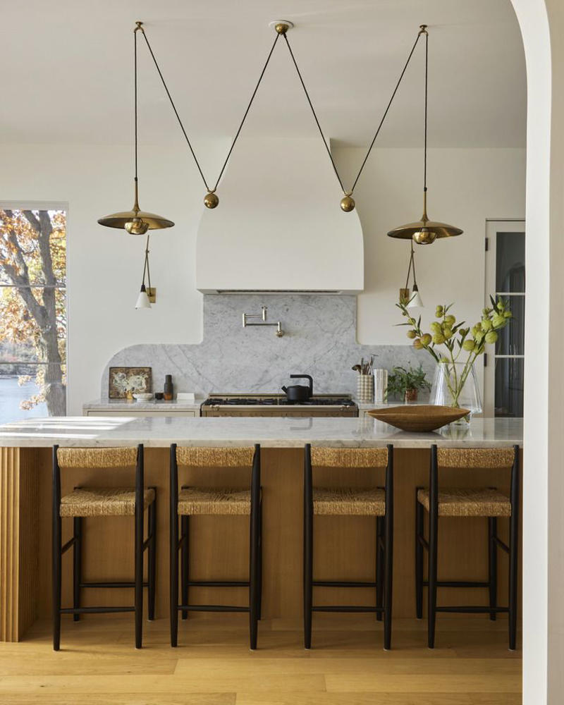 Sign #1: Knotty Pine or Orange Oak Cabinetry, Sign #2: Closed-Off Spaces, Sign #3: Quirky Decorative Details , Sign #4: High Barstools and Countertops, Sign #5: Upper Cabinetry, Sign #6: Dropped Ceilings With Fluorescent Lighting, Sign #7: Not Enough Counter Space, Sign #8: Having a Visible Microwave, Sign #9: Tiled Backsplashes, Sign #10: Granite Countertops , Sign #11: Laminate or Tile Countertops, Sign #12: All-White Shaker Cabinets, Sign #13: Word Signs, Sign #14: Oversized Can Lights, Sign #15: Outdated hardware and fixtures, Sign #16: Hanging Pot Racks, Sign #17: Intentionally Distressed Cabinets, Sign #18: Lack of Integrated Appliances, Sign #19: Having a Homemaker's Desk, Sign #20: “Hearth-Style” Vent Hoods, Sign #21: Traditional Dining Areas, Sign #22: Lack of Cohesive Materials