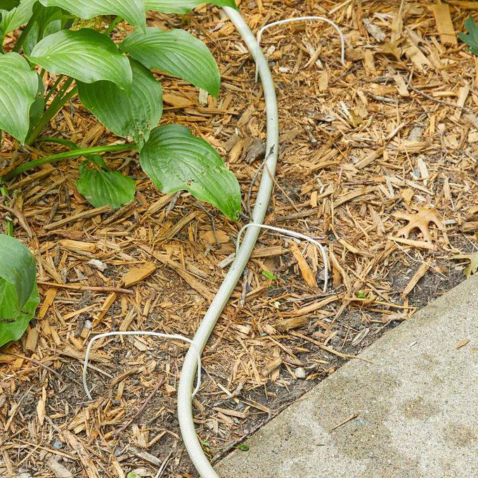 Lawn Mower Grass Chute Saver, Accessorize Your Mower, I-Spy Rain Gutter, Grass Seed Broadcaster, New Use for Old Backyard Game Pieces, Mix Concrete with a Rake, Turn an Empty Milk Jug Into a Watering Can, Long-Handled Tool Rack, Makeshift Trench Tool, Easy Apple Spear, Laundry Jug Watering Can, Tin Can Water Bottle Holder, Vacuum Attachment Holder, Tarp Cement Mixer, Sharpen Your Shovels