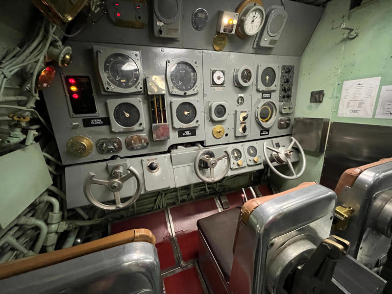 Here, the commanding officer would give orders to the crew. In the navigation compartment, crew members plotted courses and tracked Growler's position., The missile checkout and guidance center was once a top-secret area., Officers had access to their own shower., Officers used the wardroom to eat, socialize, and hold meetings., Yeomen handled clerical and administrative work aboard the USS Growler's tiny office., Here, the commanding officer would give orders to the crew., The sonar room also aided Growler's navigation., Crew members communicated with other ships in the radio room., Meals were prepared in the galley., In the scullery, Growler crew members washed dishes and compacted trash., The crew's mess was the only common space on the USS Growler., Growler's largest sleeping area contained 46 bunks., The crew's washroom featured two showers., Growler's three diesel engines were located in the engine room.
