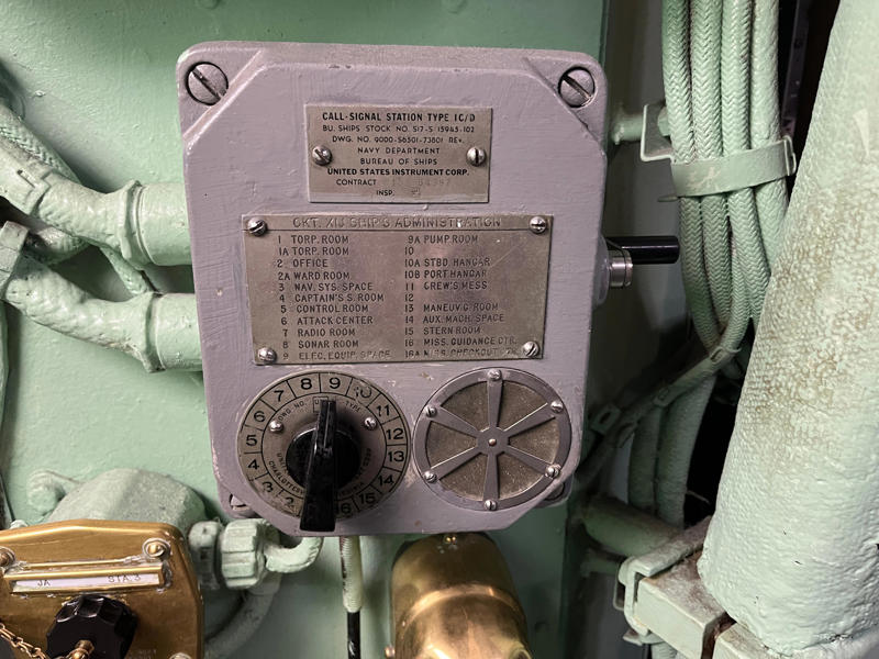 A call signal station could signal different areas of the submarine such as the ward room, the office, and the control room. In the navigation compartment, crew members plotted courses and tracked Growler's position., The missile checkout and guidance center was once a top-secret area., Officers had access to their own shower., Officers used the wardroom to eat, socialize, and hold meetings., Yeomen handled clerical and administrative work aboard the USS Growler's tiny office., Here, the commanding officer would give orders to the crew., The sonar room also aided Growler's navigation., Crew members communicated with other ships in the radio room., Meals were prepared in the galley., In the scullery, Growler crew members washed dishes and compacted trash., The crew's mess was the only common space on the USS Growler., Growler's largest sleeping area contained 46 bunks., The crew's washroom featured two showers., Growler's three diesel engines were located in the engine room.