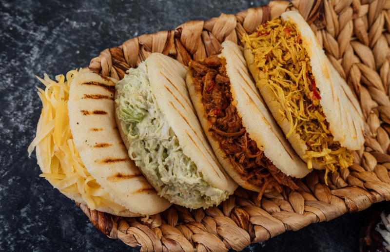 23. Arepa, Venezuela and Colombia 36. Bitterballen, Netherlands, 35. Pierogi, Poland, 34. Choripán, Argentina, 33. Slider, USA, 32. Elote, Mexico, 31. Rolex, Uganda, 30. Pad Thai, Thailand, 29. Souvlaki, Greece, 28. Bhelpuri, India, 27. Bánh mì, Vietnam, 26. Ta’ameya, Egypt, 25. Chǎofàn, China, 24. Shawarma, Turkey, 23. Arepa, Venezuela and Colombia, 22. Vada pav, India, 21. Gyros, Greece, 20. Churros, Spain, 19. Bao buns, China, 18. Fish and chips, UK, 17. Takoyaki, Japan, 16. Currywurst, Germany, 15. Burrito, Mexico or USA, 14. Döner kebab, Germany, 13. Bunny chow, South Africa, 12. Tacos, Mexico, 11. Meat pie, Australia, 10. Bratwurst, Germany, 9. Samosa, India, 8. Poutine, Canada, 7. Cheeseburger, USA, 6. Fried chicken, various locations, 5. Hot dog, various locations, 4. Fried chicken sandwich, USA, 3. Pizza, Italy, 2. Hamburger, various locations