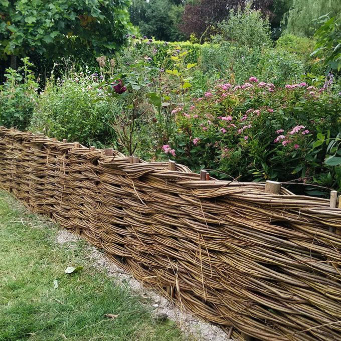 Deer Fence, Wood Fence With Finials, Pallet Wood Fence, Rustic Wood Stick Fence, Wire-Rolled Picket Fence, Cedar Wood Fence, Crossbuck Fence, Salvaged Door Fence, Willow Weave Fence, Repurposed Wood Garden Fence, About the Expert